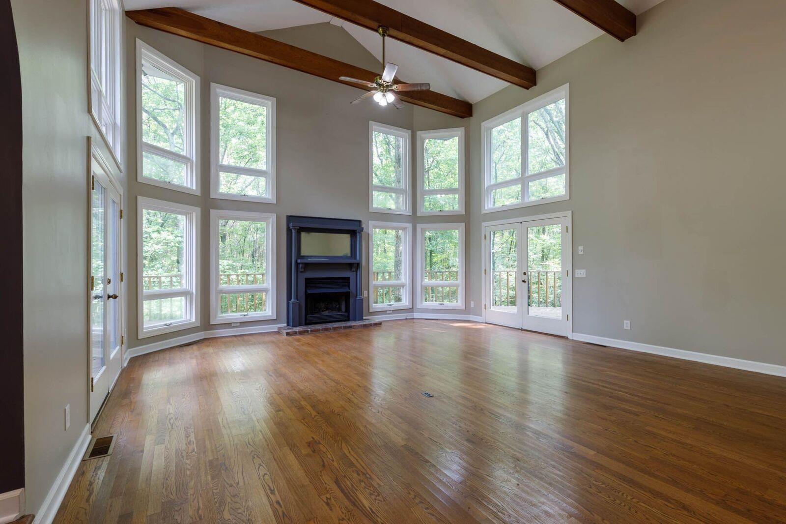 5831 Cane Ridge Road Antioch, TN 37013 - Photo 5 of 30 a view of an empty room with wooden floor and a window