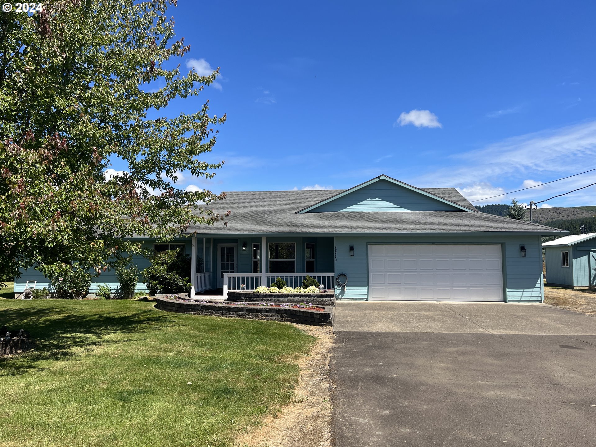 48420 Southwest Hebo Road Grand Ronde, OR 97347 - Photo 1 of 48 a front view of a house with swimming pool yard and outdoor seating