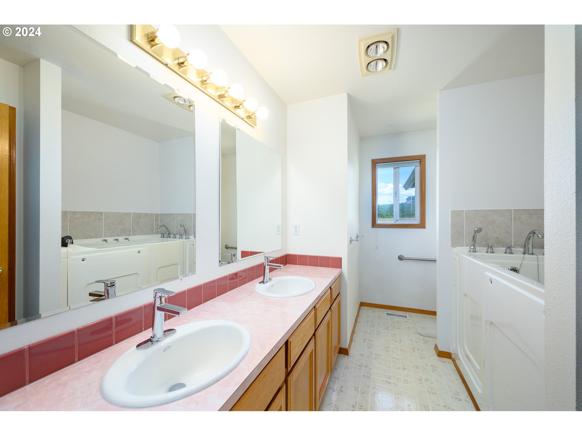48420 Southwest Hebo Road Grand Ronde, OR 97347 - Photo 24 of 48 a bathroom with a sink double vanity granite tub and a mirror