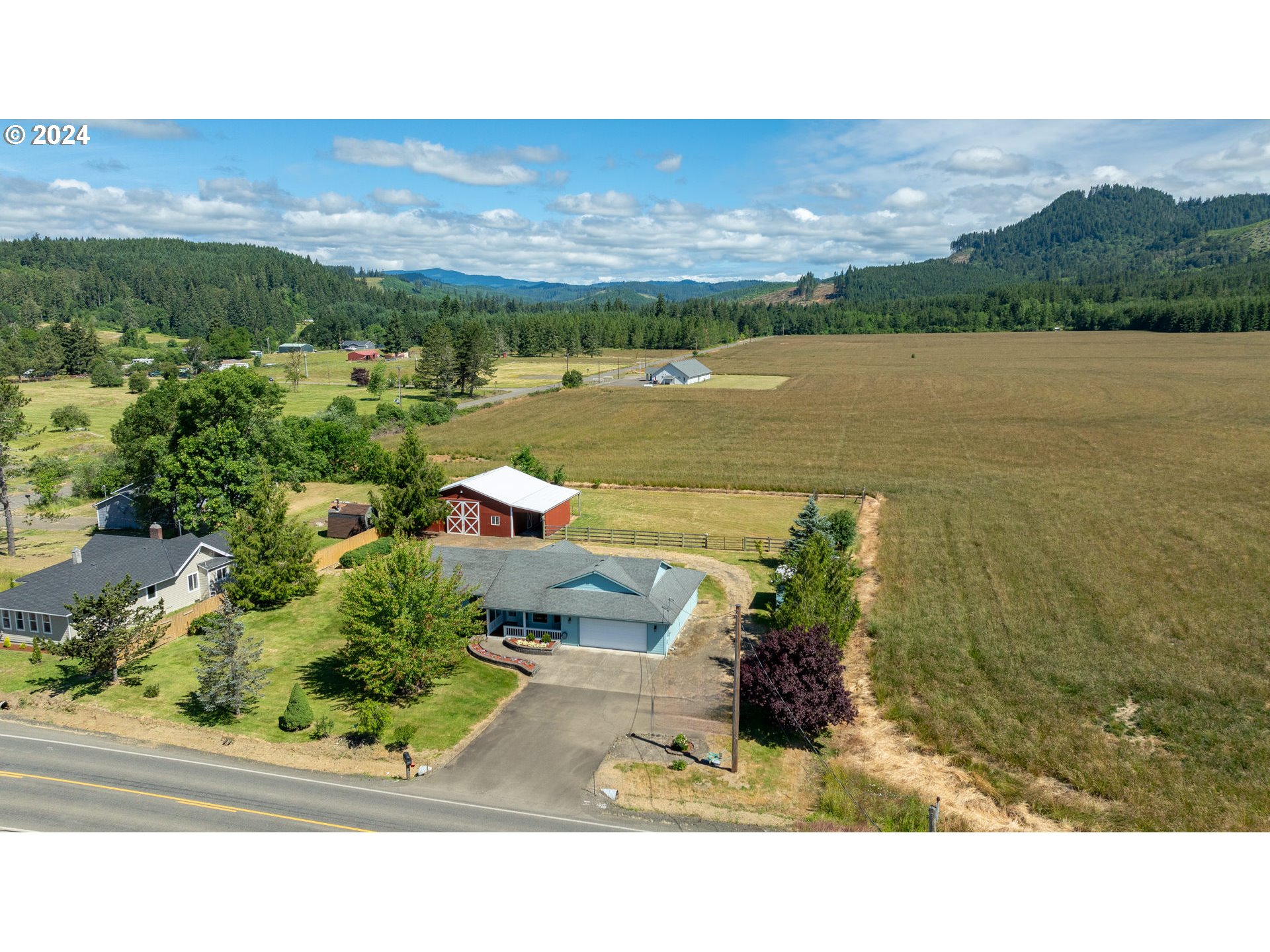48420 Southwest Hebo Road Grand Ronde, OR 97347 - Photo 28 of 48 a view of a lake with a building in the background