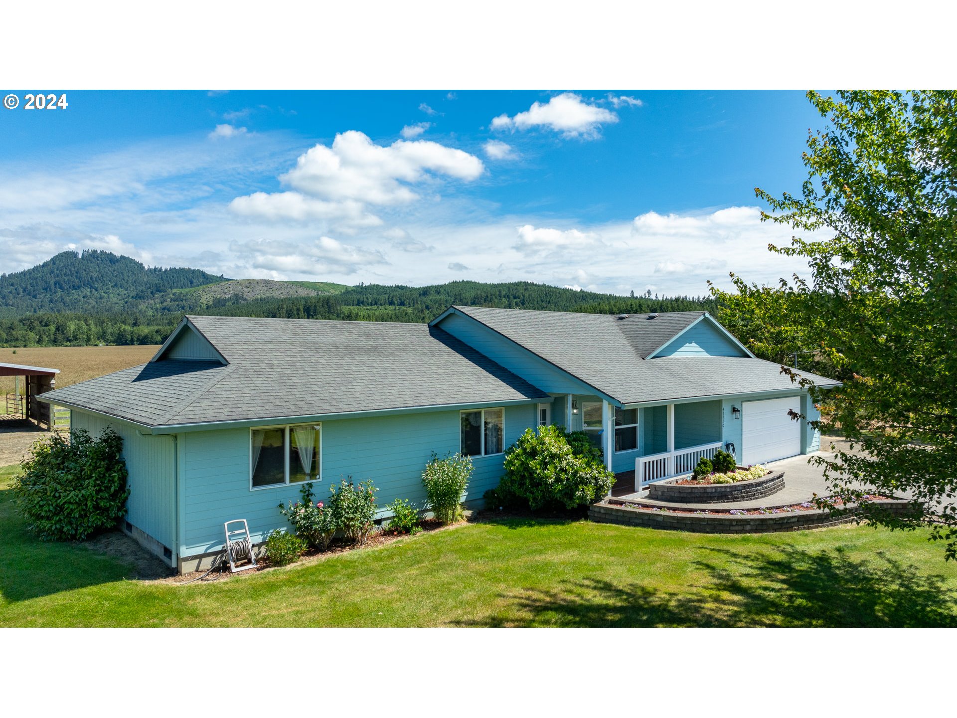 48420 Southwest Hebo Road Grand Ronde, OR 97347 - Photo 29 of 48 a aerial view of a house with table and chairs