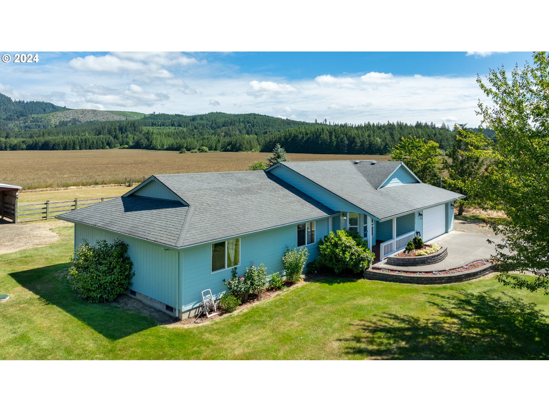 48420 Southwest Hebo Road Grand Ronde, OR 97347 - Photo 35 of 48 a aerial view of a house with a yard table and chairs