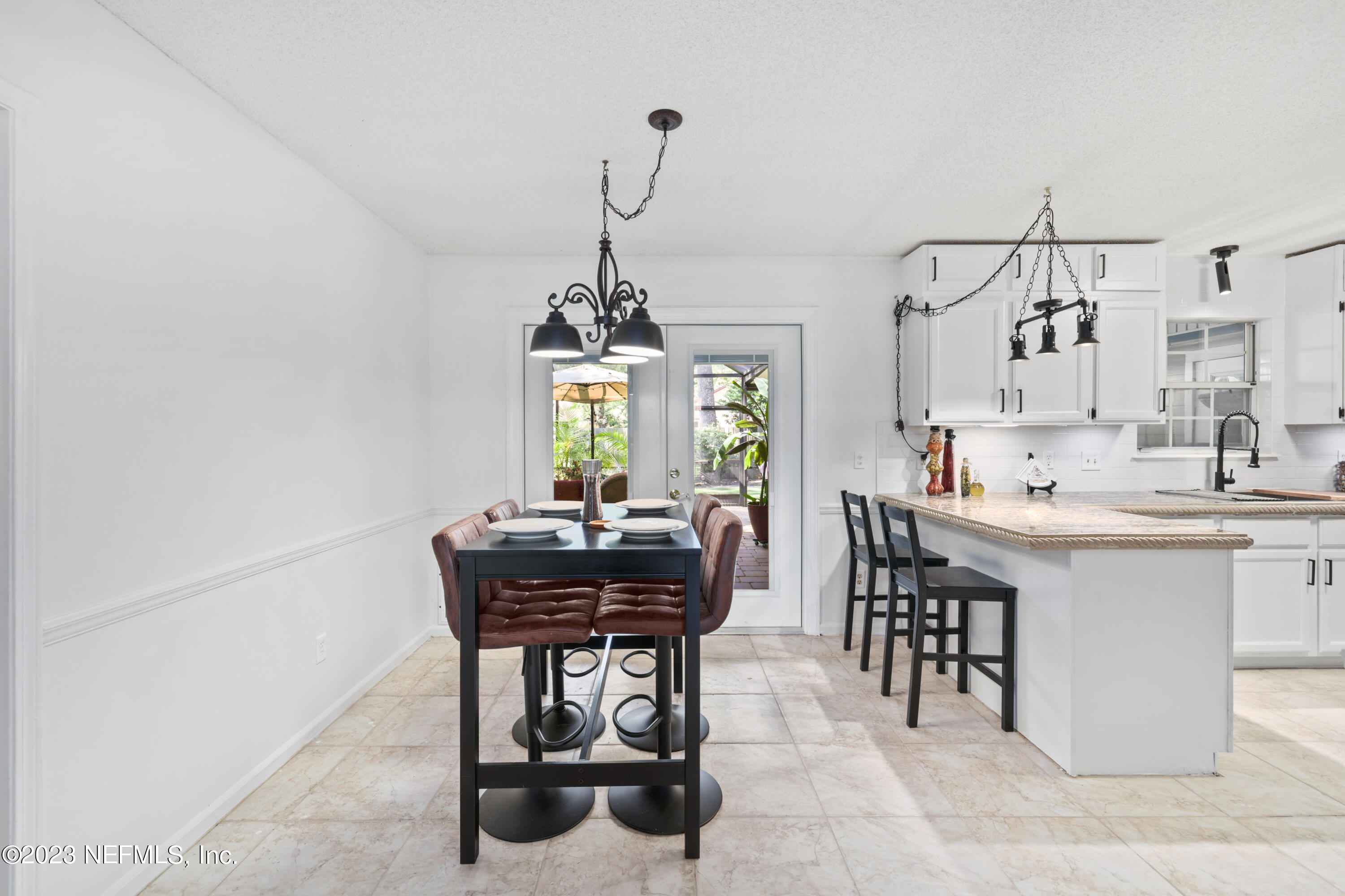 10954 Heathfield Road Jacksonville, FL 32225 - Photo 18 of 42 a view of a dining room with furniture