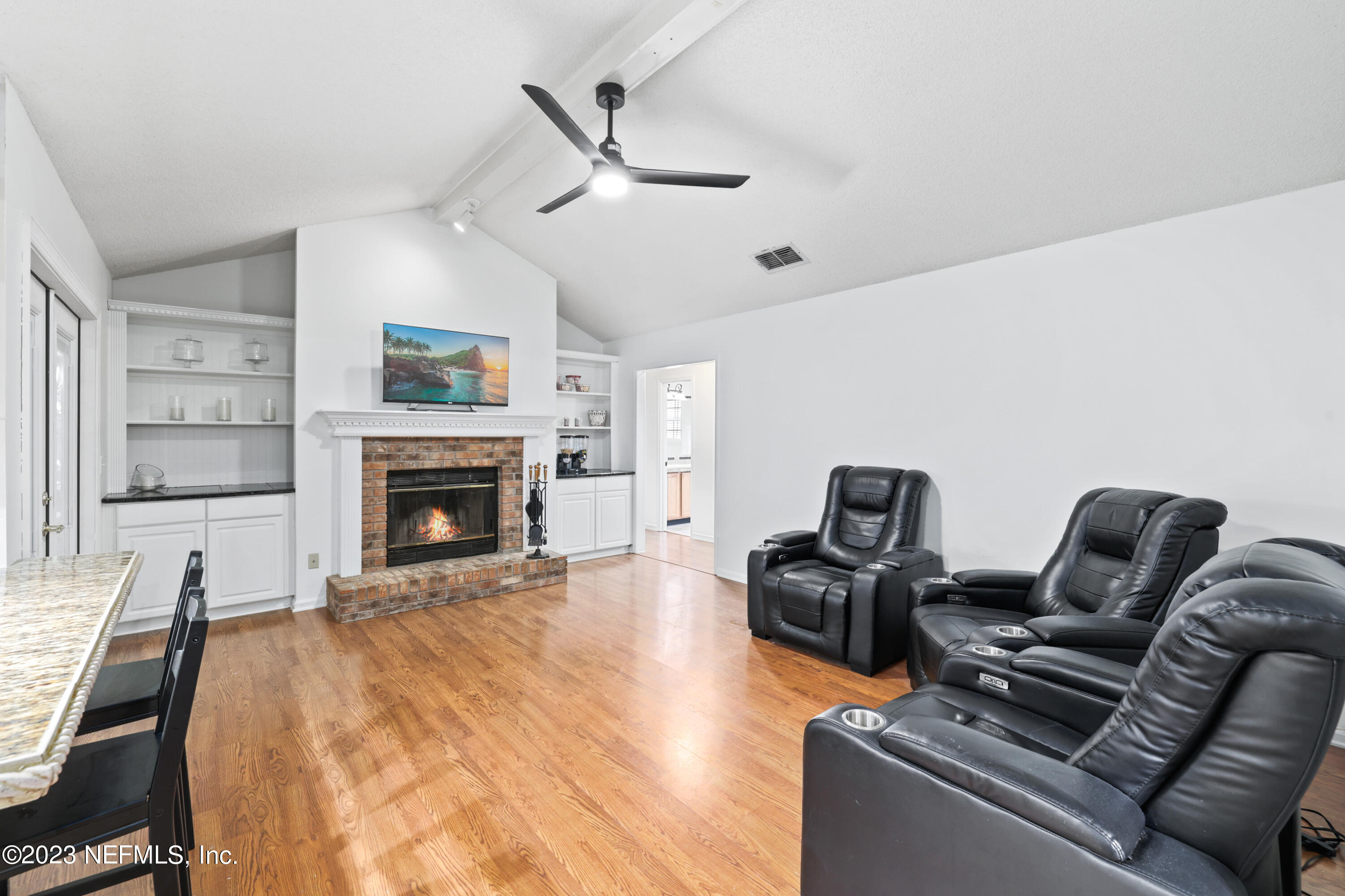 10954 Heathfield Road Jacksonville, FL 32225 - Photo 19 of 42 a living room with furniture and a fireplace