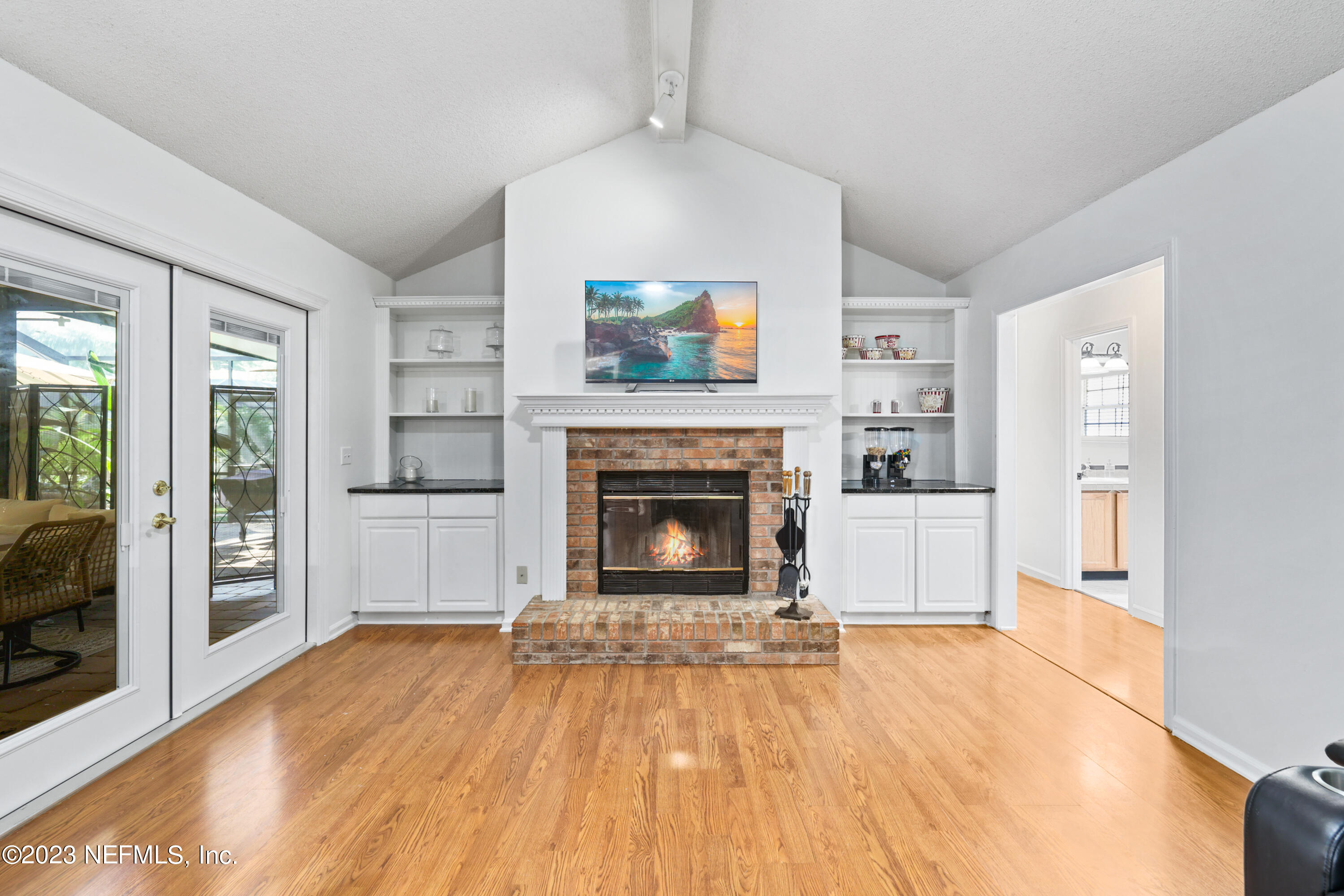 10954 Heathfield Road Jacksonville, FL 32225 - Photo 20 of 42 a view of a livingroom with an empty space and a fireplace