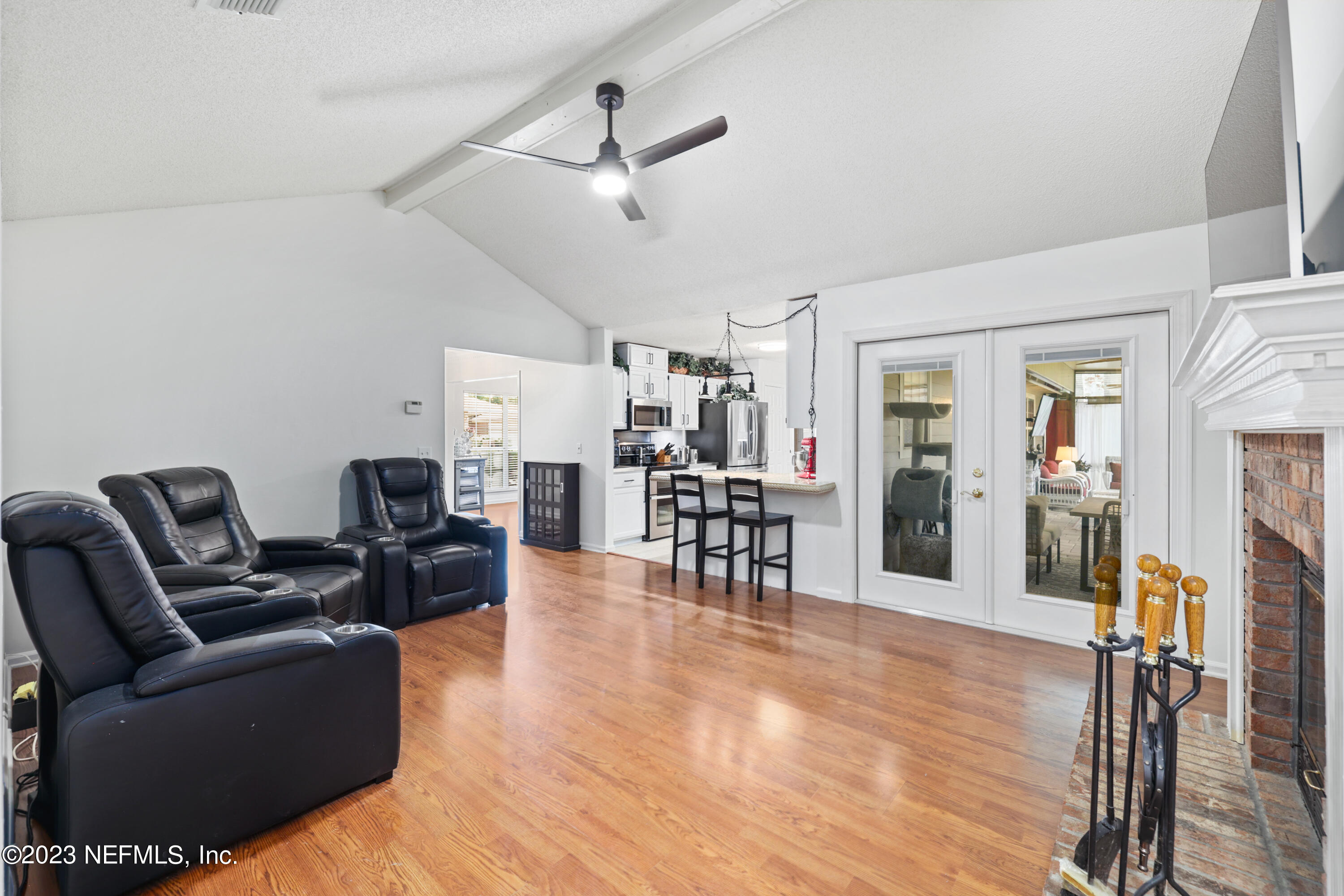 10954 Heathfield Road Jacksonville, FL 32225 - Photo 22 of 42 a living room with furniture and a wooden floor