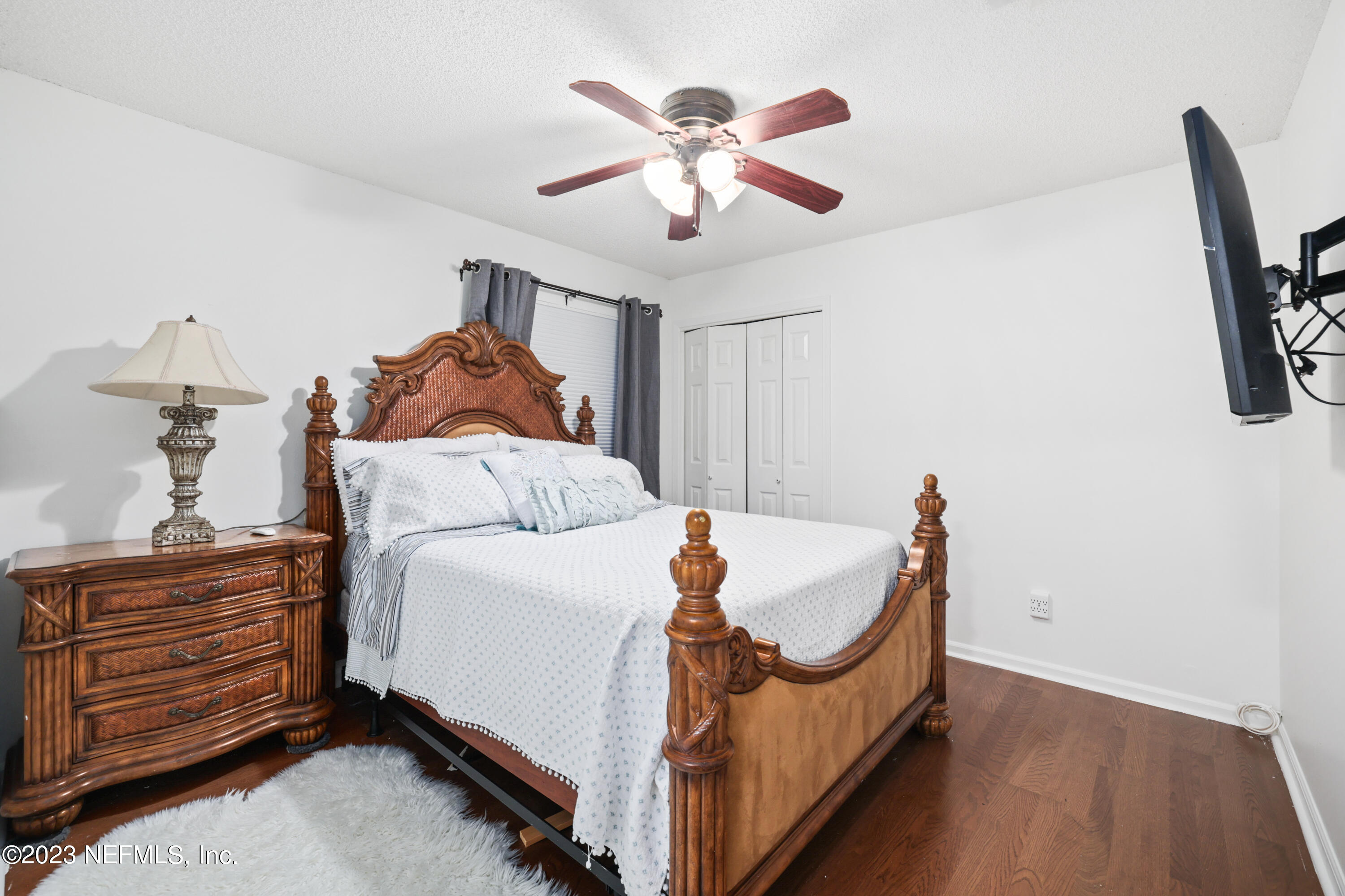 10954 Heathfield Road Jacksonville, FL 32225 - Photo 23 of 42 a bed room with a bed and a ceiling fan