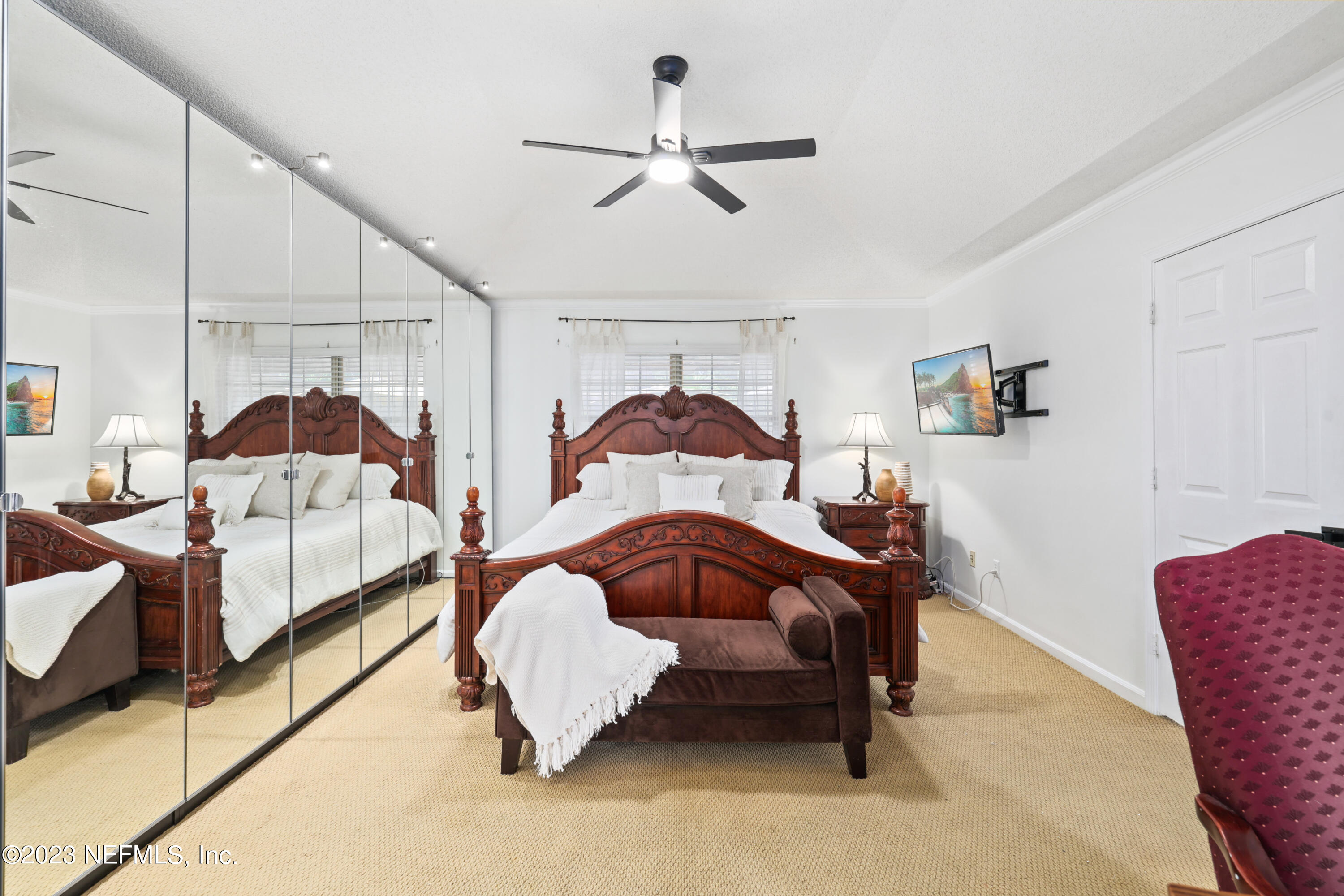 10954 Heathfield Road Jacksonville, FL 32225 - Photo 27 of 42 a bedroom with a bed and a lamp