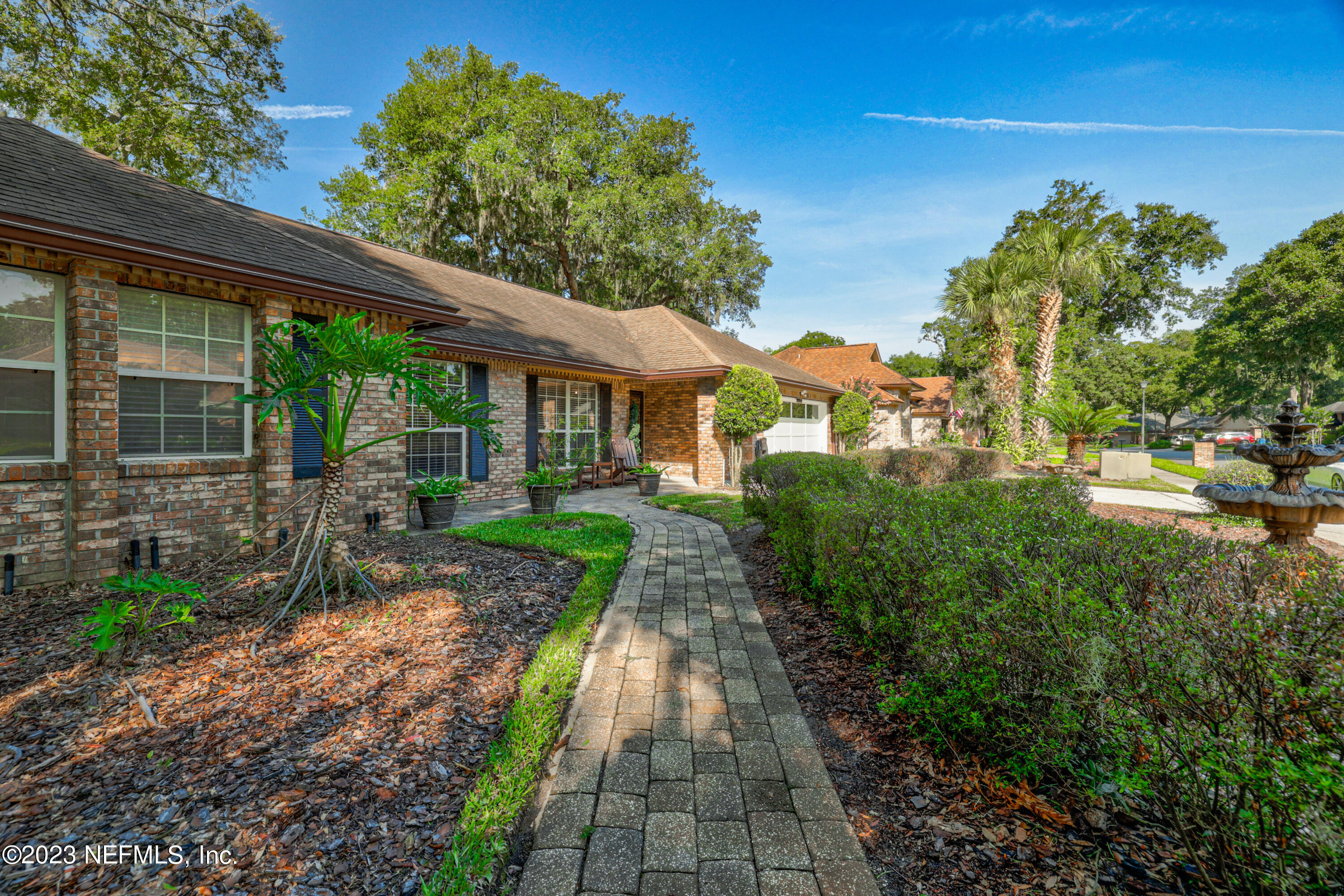 10954 Heathfield Road Jacksonville, FL 32225 - Photo 3 of 42 a front view of a house with a yard