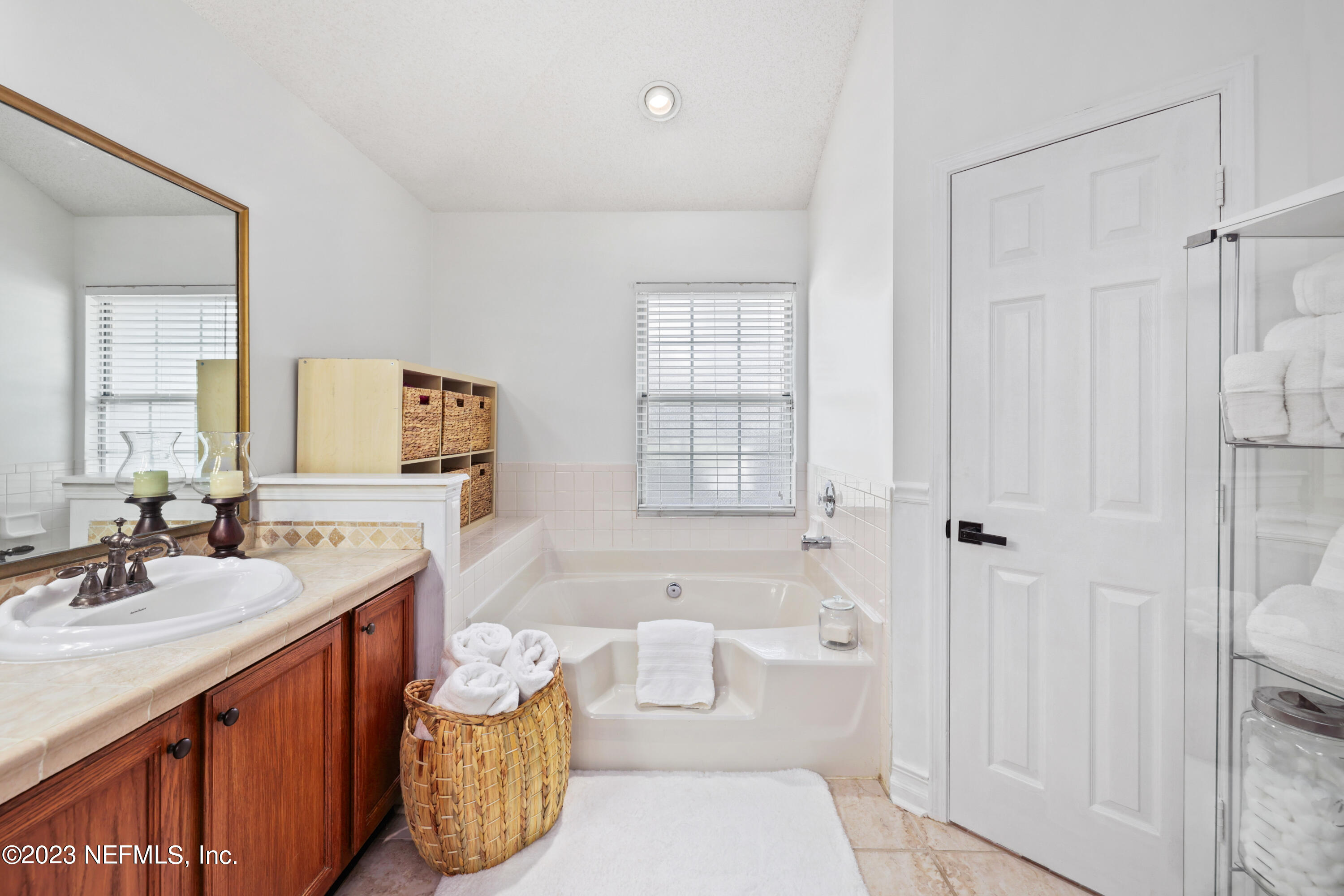 10954 Heathfield Road Jacksonville, FL 32225 - Photo 31 of 42 a bathroom with a sink a toilet and shower