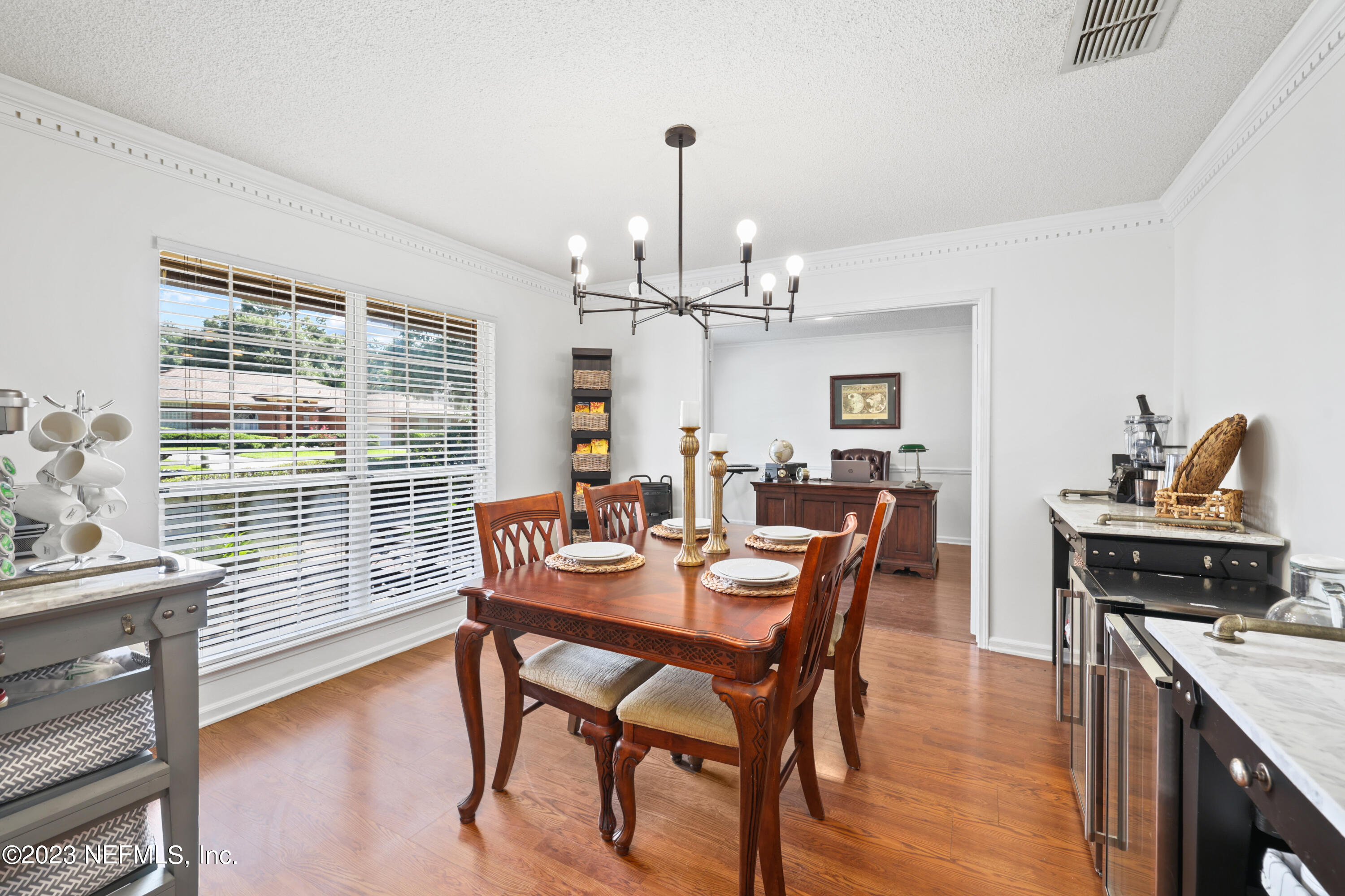 10954 Heathfield Road Jacksonville, FL 32225 - Photo 6 of 42 a view of a dining room with furniture window and wooden floor