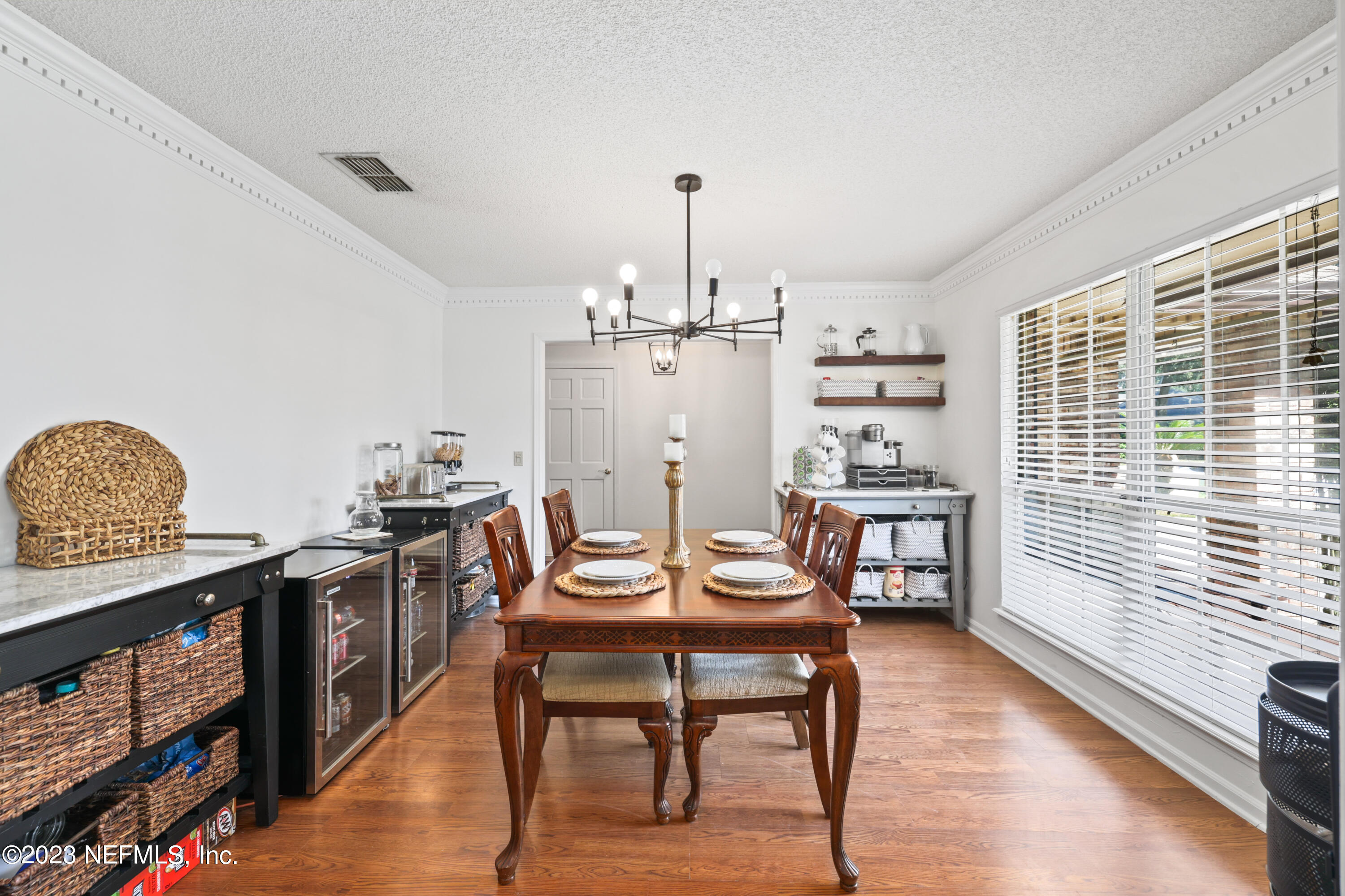 10954 Heathfield Road Jacksonville, FL 32225 - Photo 7 of 42 a dining room with furniture and wooden floor