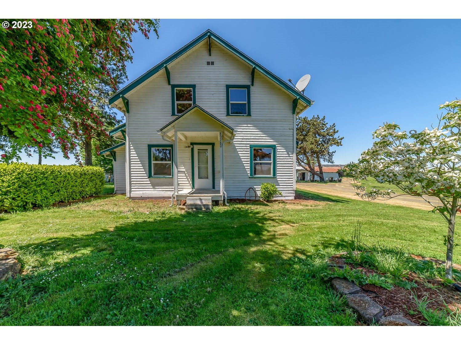 89780 Green Hill Road Eugene, OR 97402 - Photo 1 of 48 a front view of a house with a yard