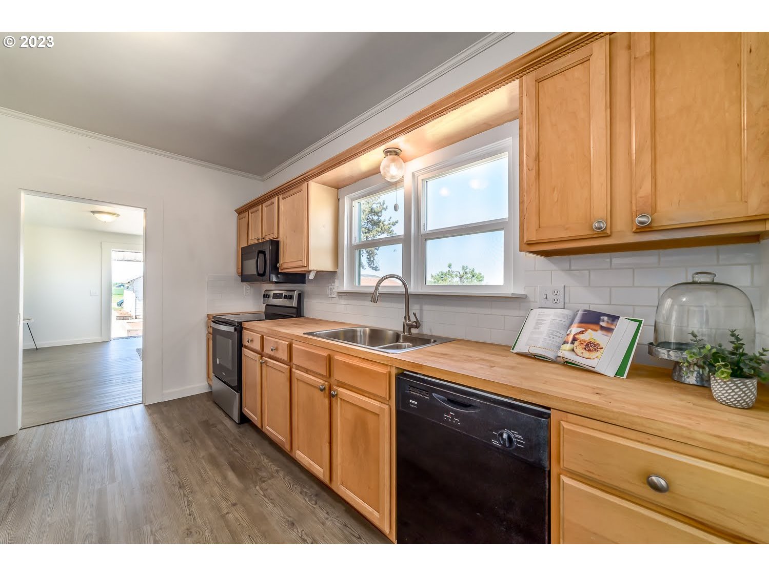 89780 Green Hill Road Eugene, OR 97402 - Photo 21 of 48 a kitchen with a sink a window and cabinets