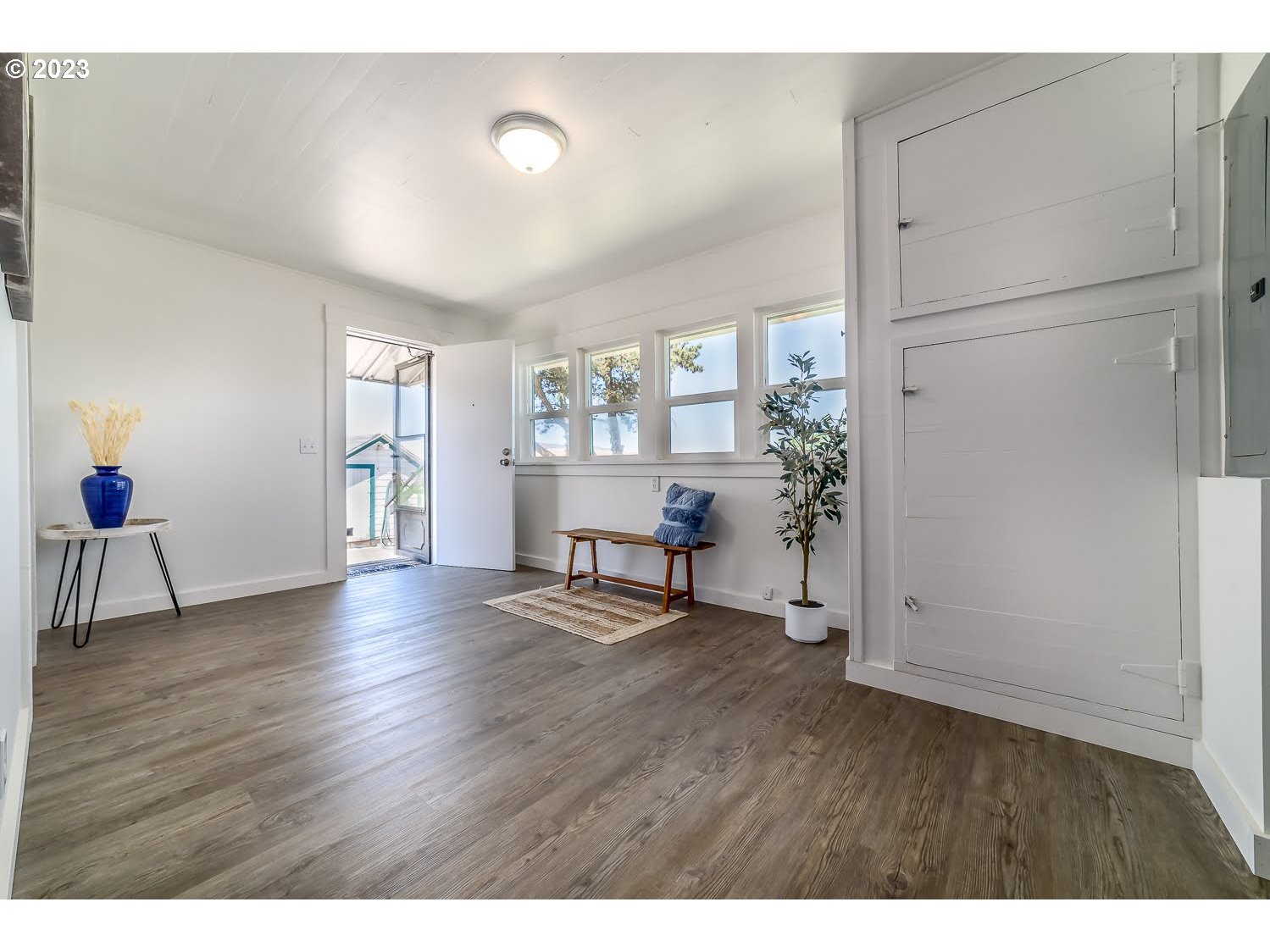 89780 Green Hill Road Eugene, OR 97402 - Photo 23 of 48 a view of an empty room with a window and wooden floor