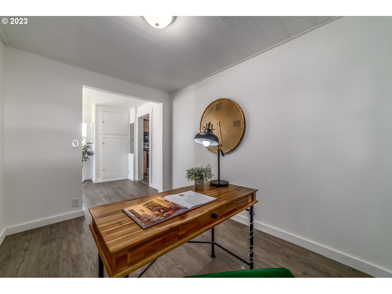 89780 Green Hill Road Eugene, OR 97402 - Photo 25 of 48 a living room with a table and paintings on the wall