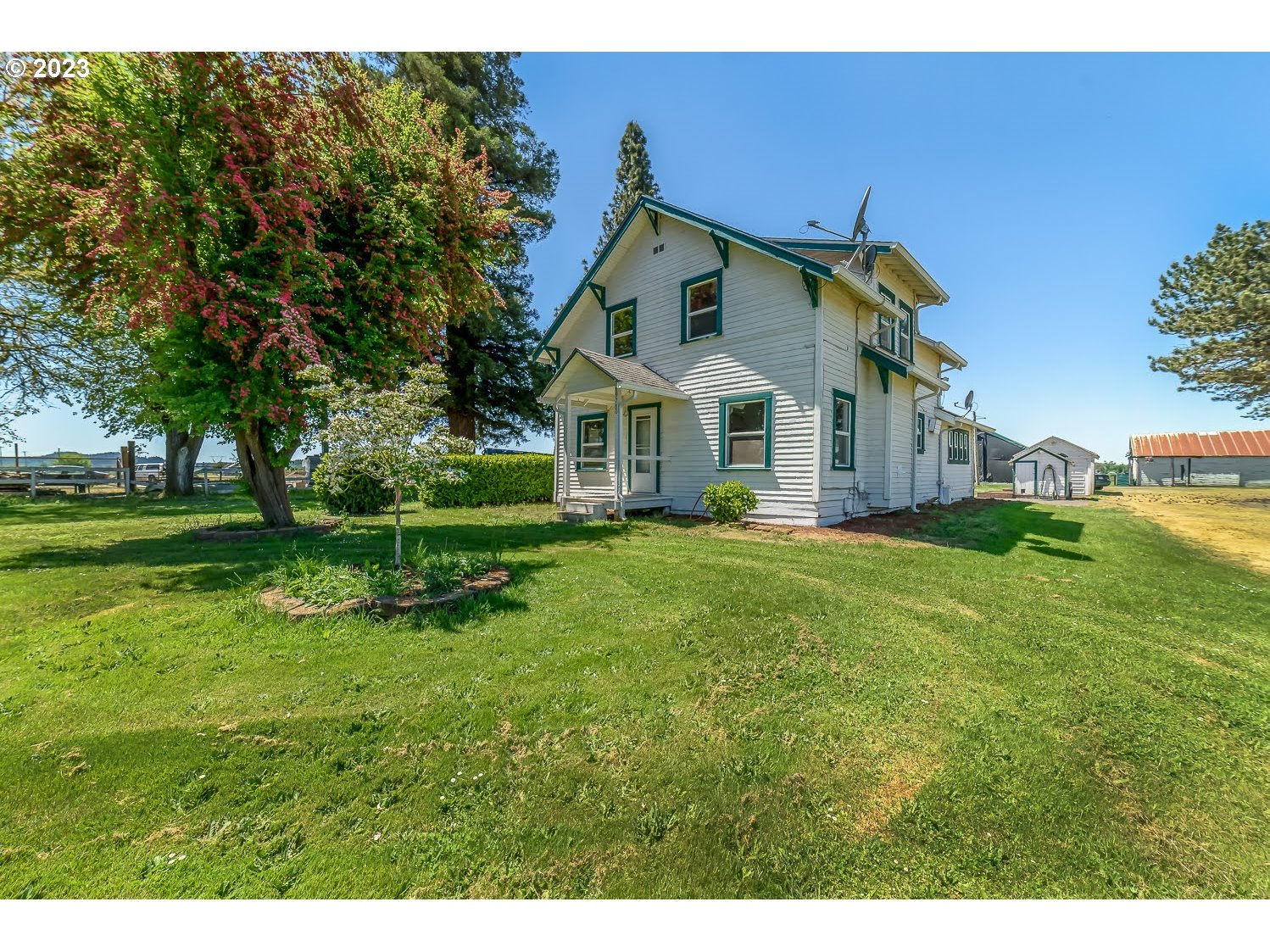 89780 Green Hill Road Eugene, OR 97402 - Photo 3 of 48 a front view of a house with a yard
