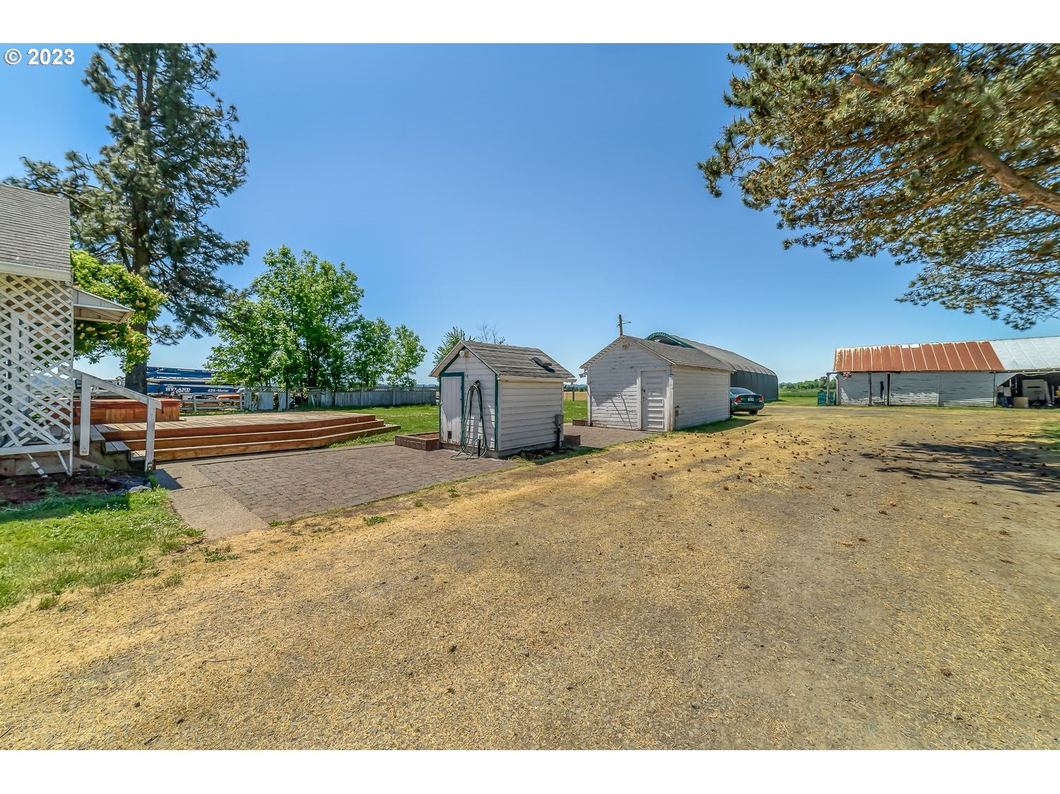 89780 Green Hill Road Eugene, OR 97402 - Photo 9 of 48 a backyard of a house with table and chairs