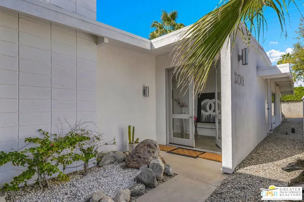 a view of a house with backyard and entertaining space