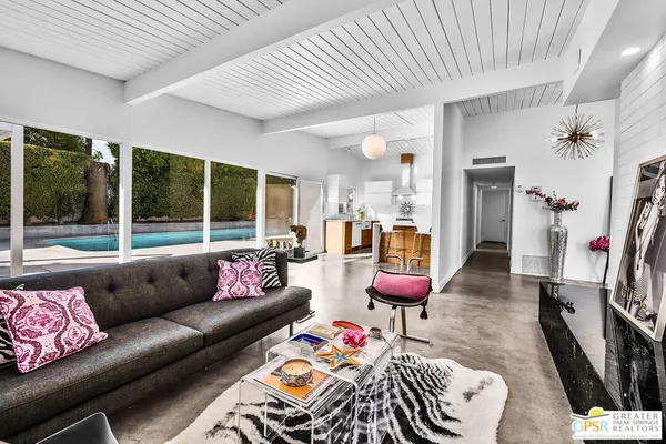 a room with lots of table and chairs