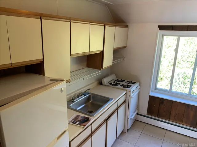 a kitchen that has a stove and a microwave