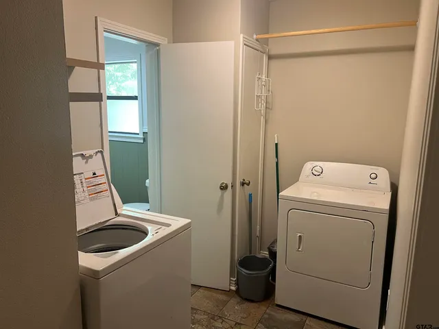 a utility room with dryer and washer