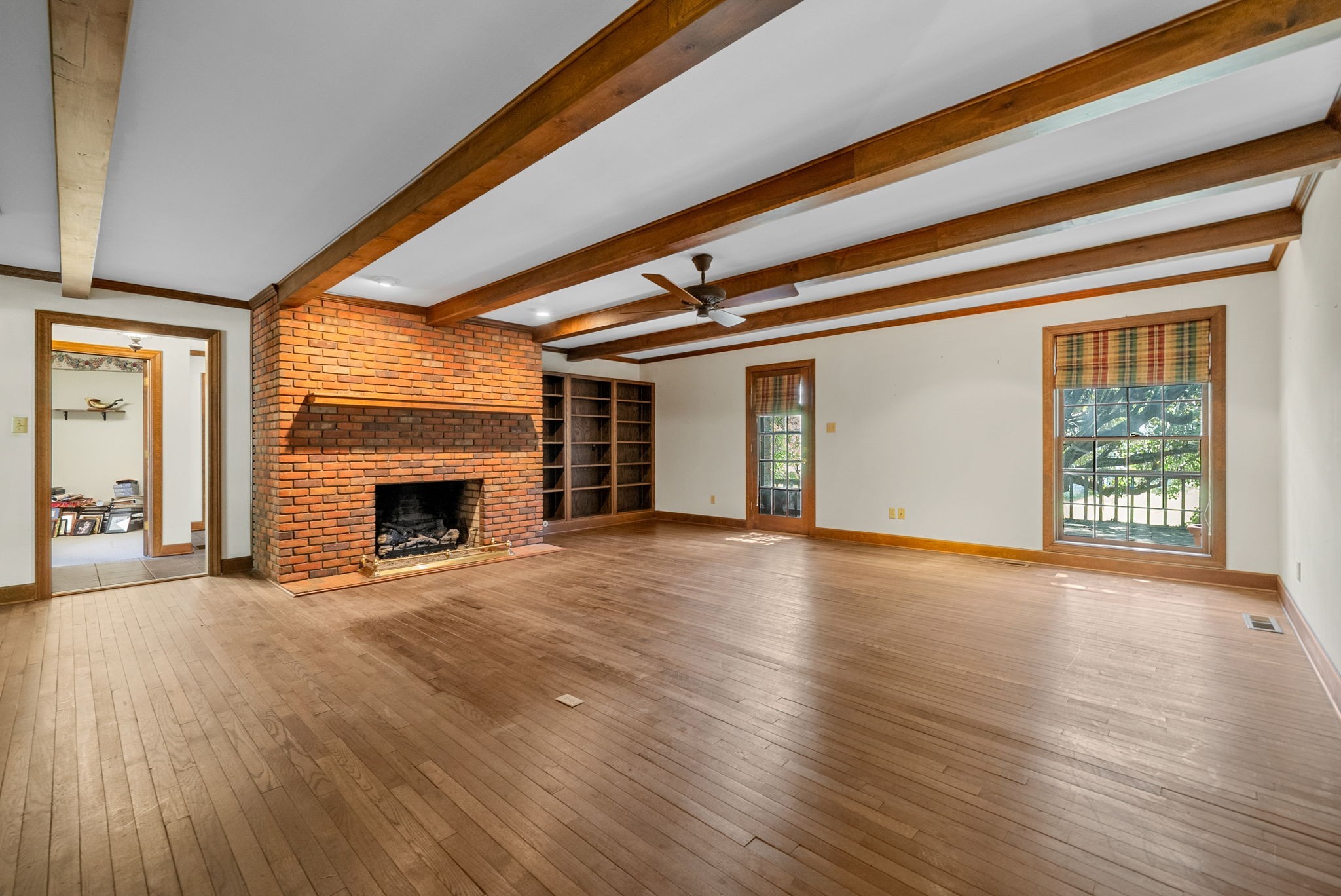 3058 Cox Mill Road Hopkinsville, KY 42240 - Photo 12 of 60 a view of empty room with wooden floor and fireplace