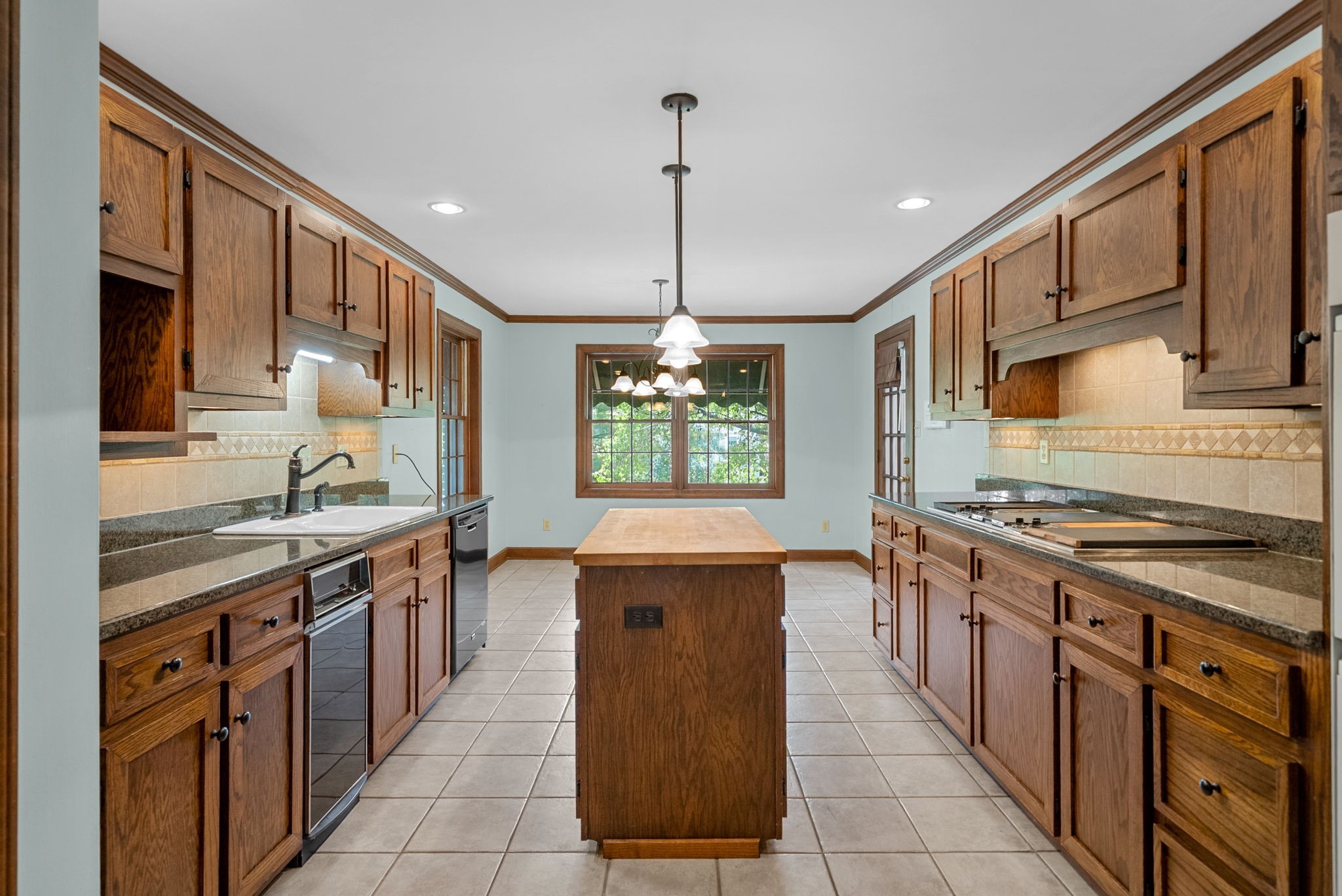 3058 Cox Mill Road Hopkinsville, KY 42240 - Photo 18 of 60 a kitchen with stainless steel appliances granite countertop a stove a sink dishwasher and a refrigerator