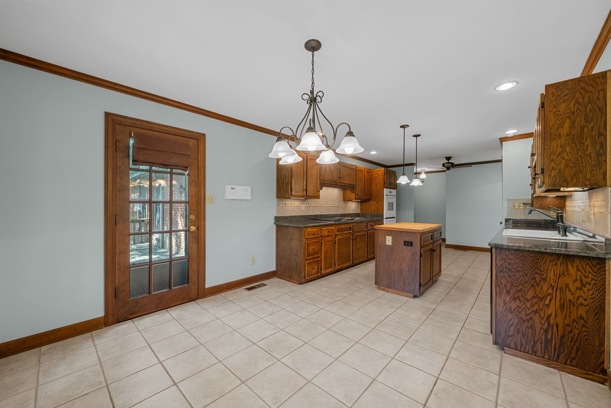 3058 Cox Mill Road Hopkinsville, KY 42240 - Photo 22 of 60 a kitchen with sink cabinets and window