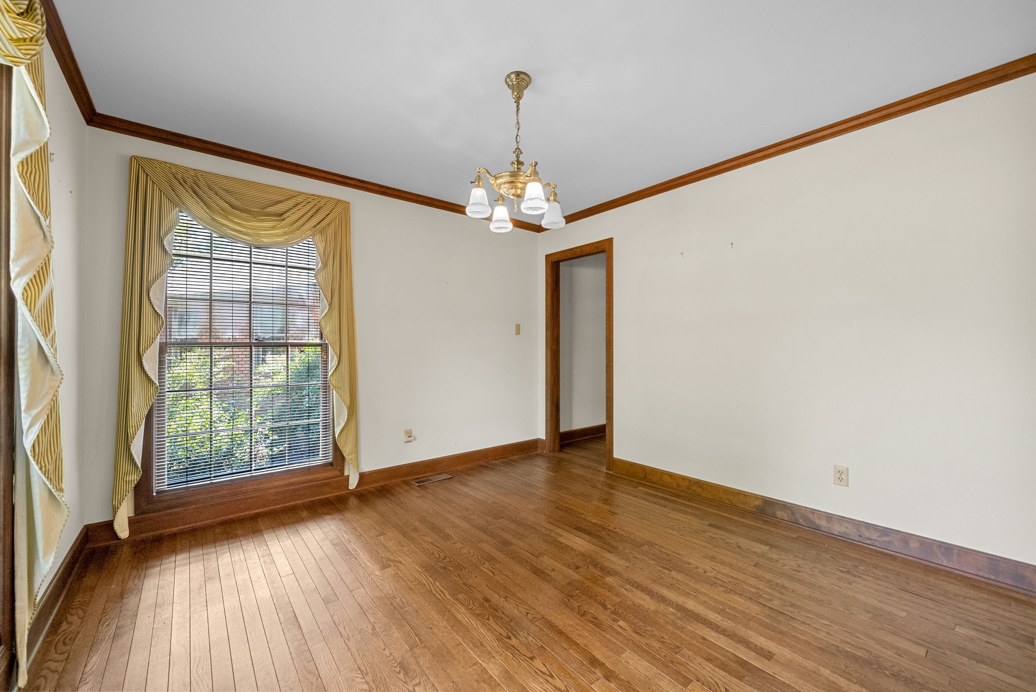 3058 Cox Mill Road Hopkinsville, KY 42240 - Photo 25 of 60 wooden floor in an empty room with a window