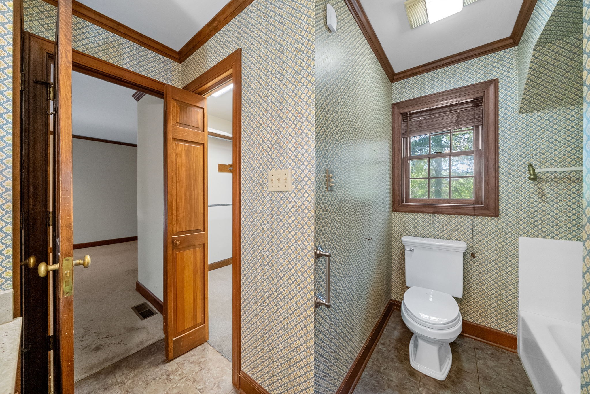 3058 Cox Mill Road Hopkinsville, KY 42240 - Photo 31 of 60 a bathroom with a toilet sink and a shower