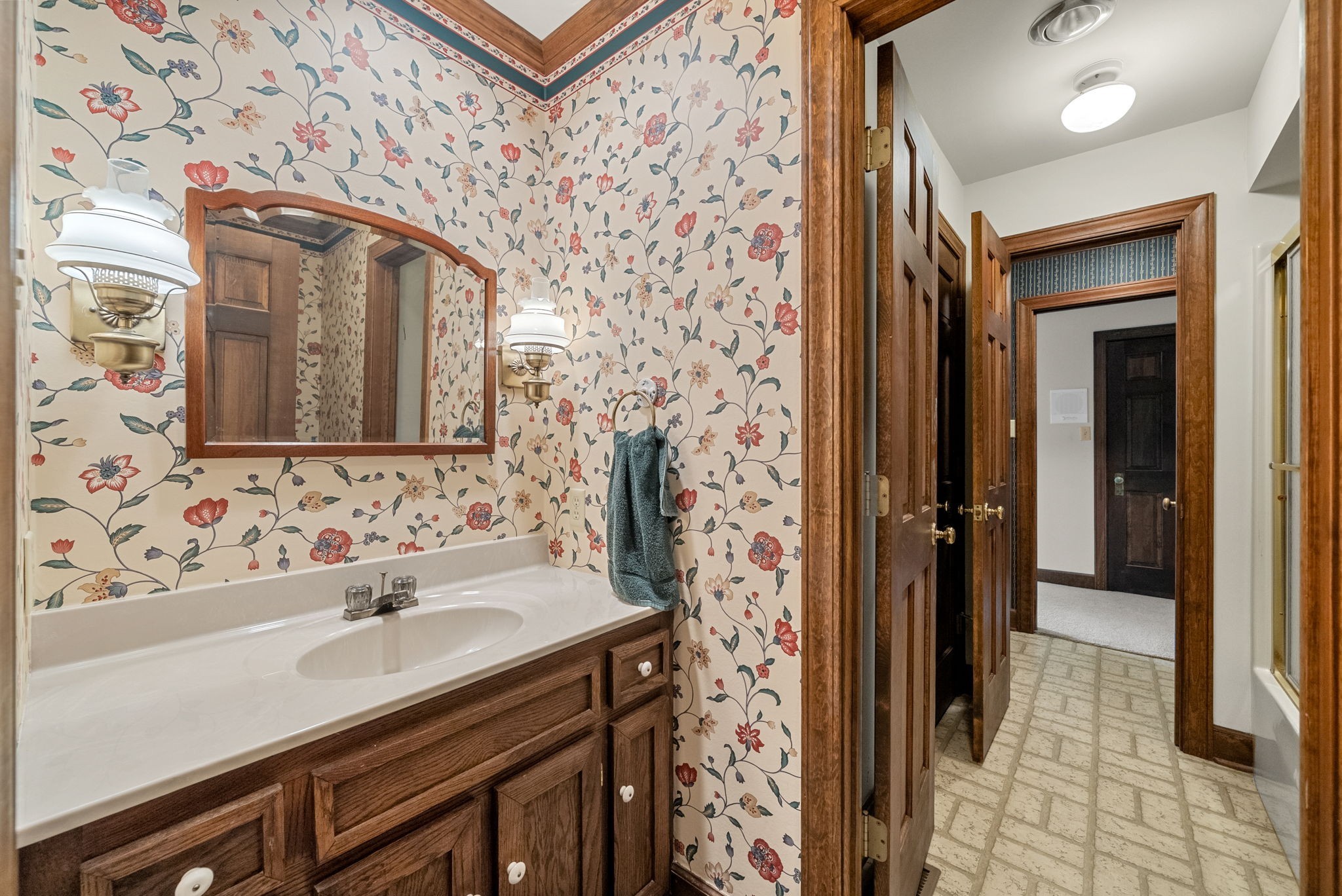 3058 Cox Mill Road Hopkinsville, KY 42240 - Photo 39 of 60 a bathroom with a sink and a mirror