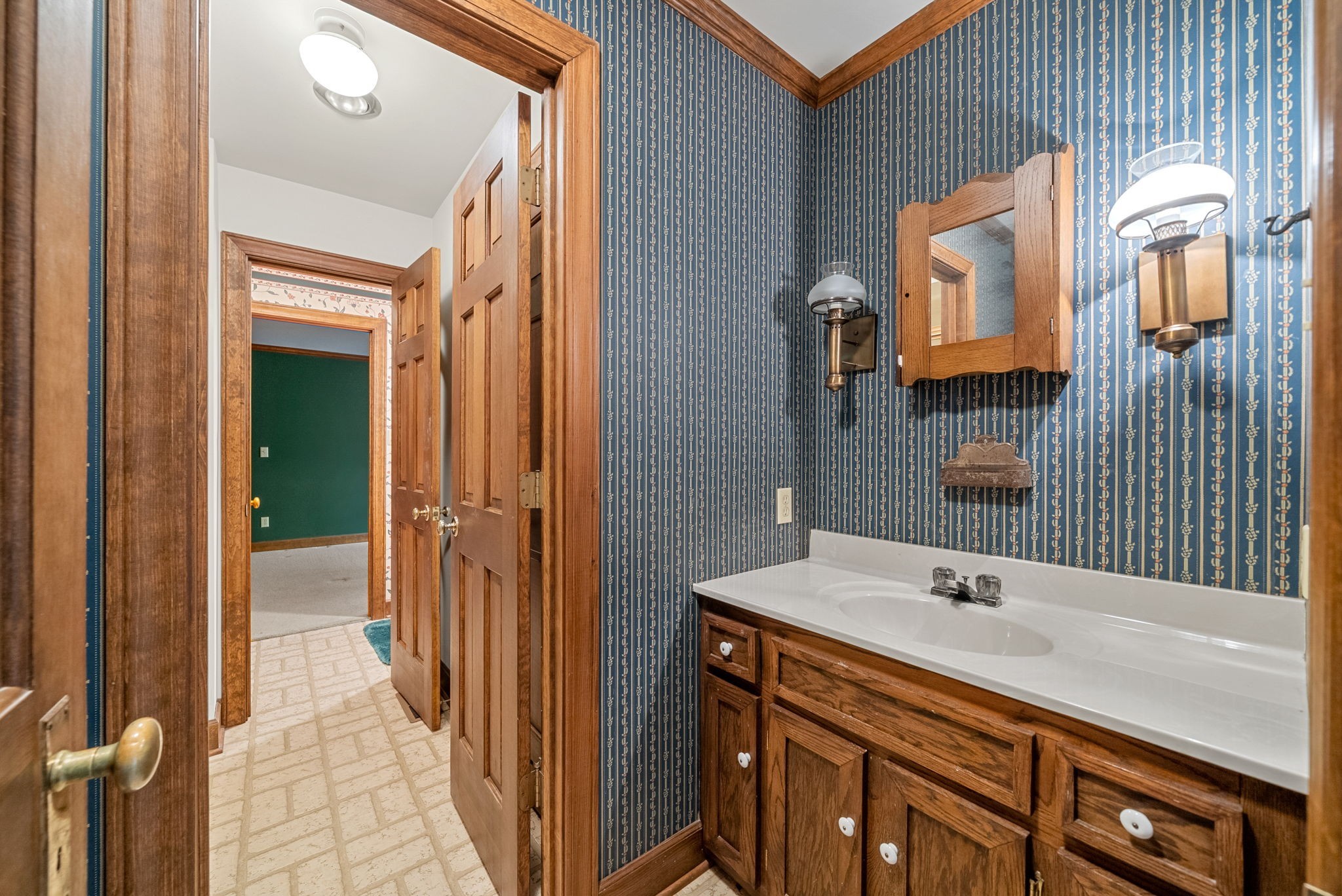 3058 Cox Mill Road Hopkinsville, KY 42240 - Photo 40 of 60 a bathroom with a tub sink and mirror