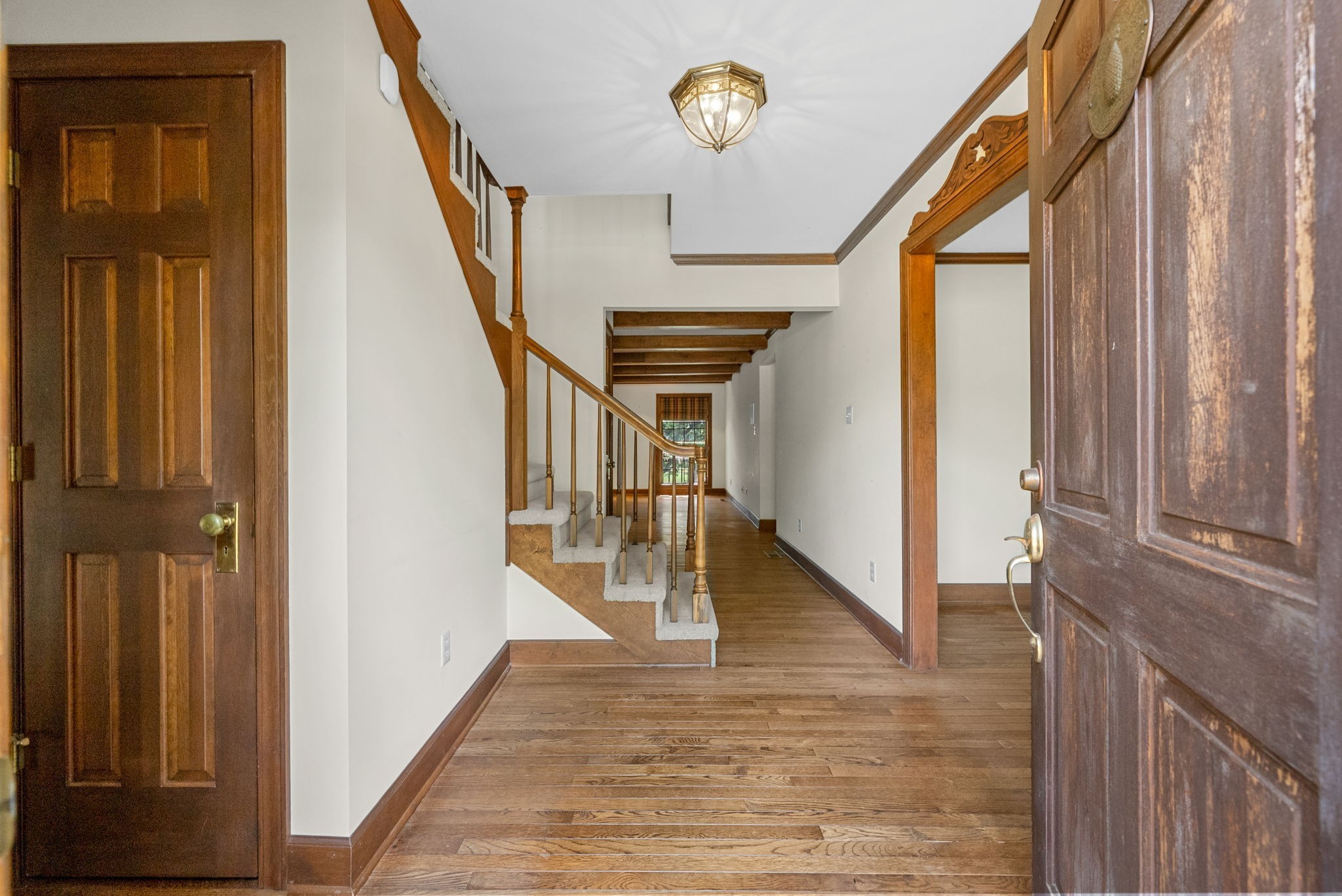 3058 Cox Mill Road Hopkinsville, KY 42240 - Photo 8 of 60 a view of a hallway with wooden floor and staircase