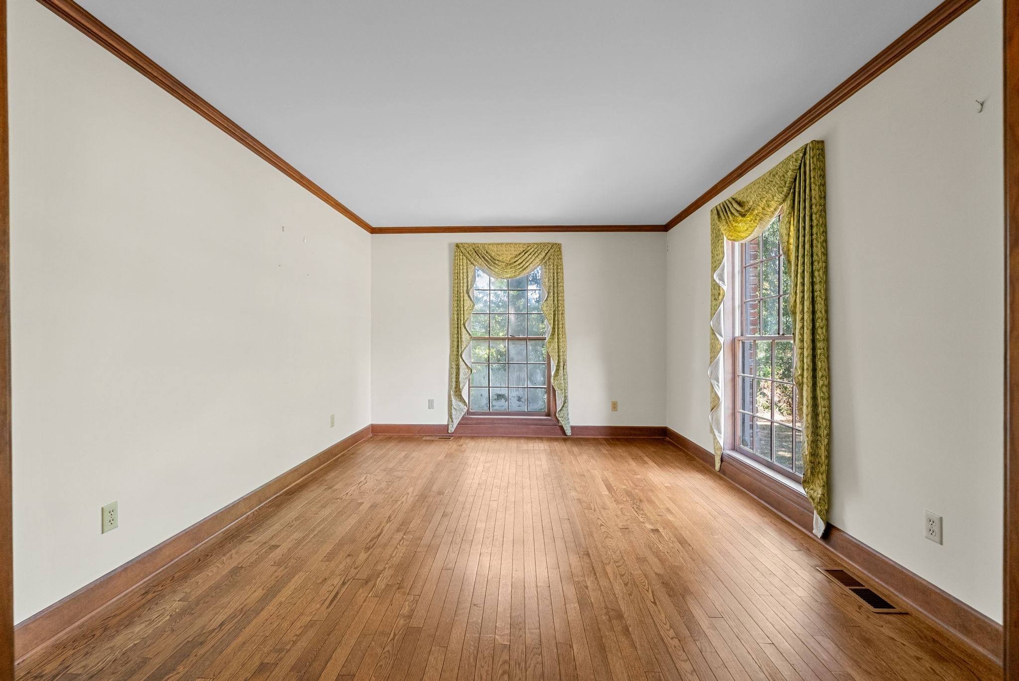 3058 Cox Mill Road Hopkinsville, KY 42240 - Photo 10 of 60 a view of an empty room with wooden floor and a window