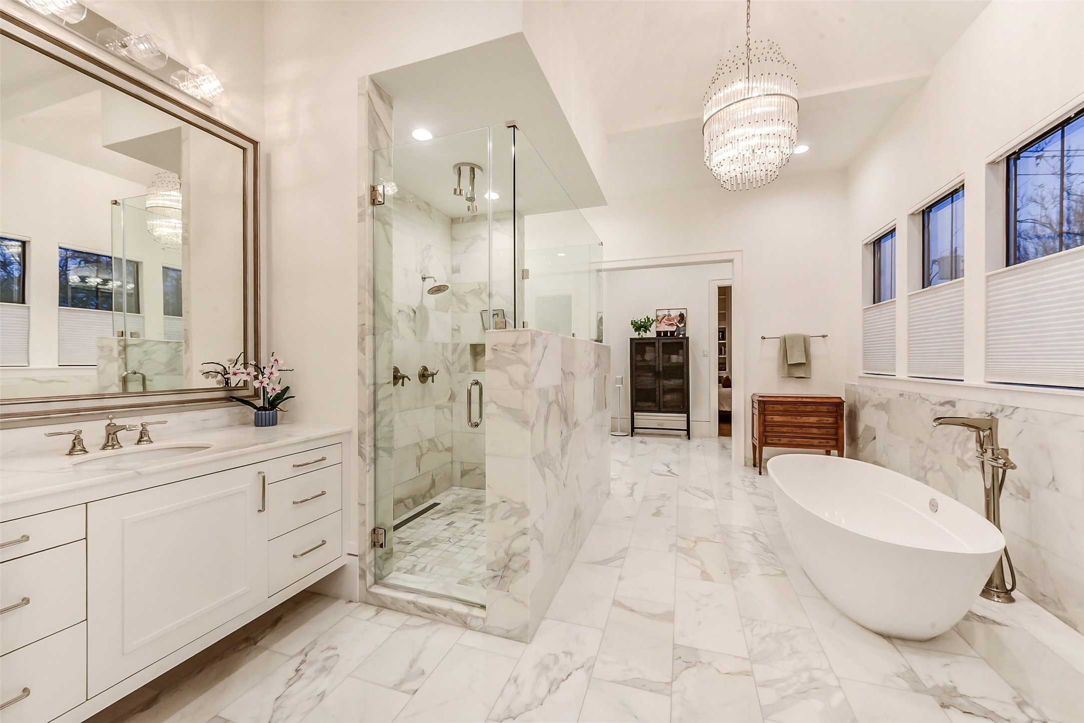 2205 Goldsmith Street Houston, TX 77030 - Photo 15 of 44 a spacious bathroom with a double vanity sink a large mirror and a shower
