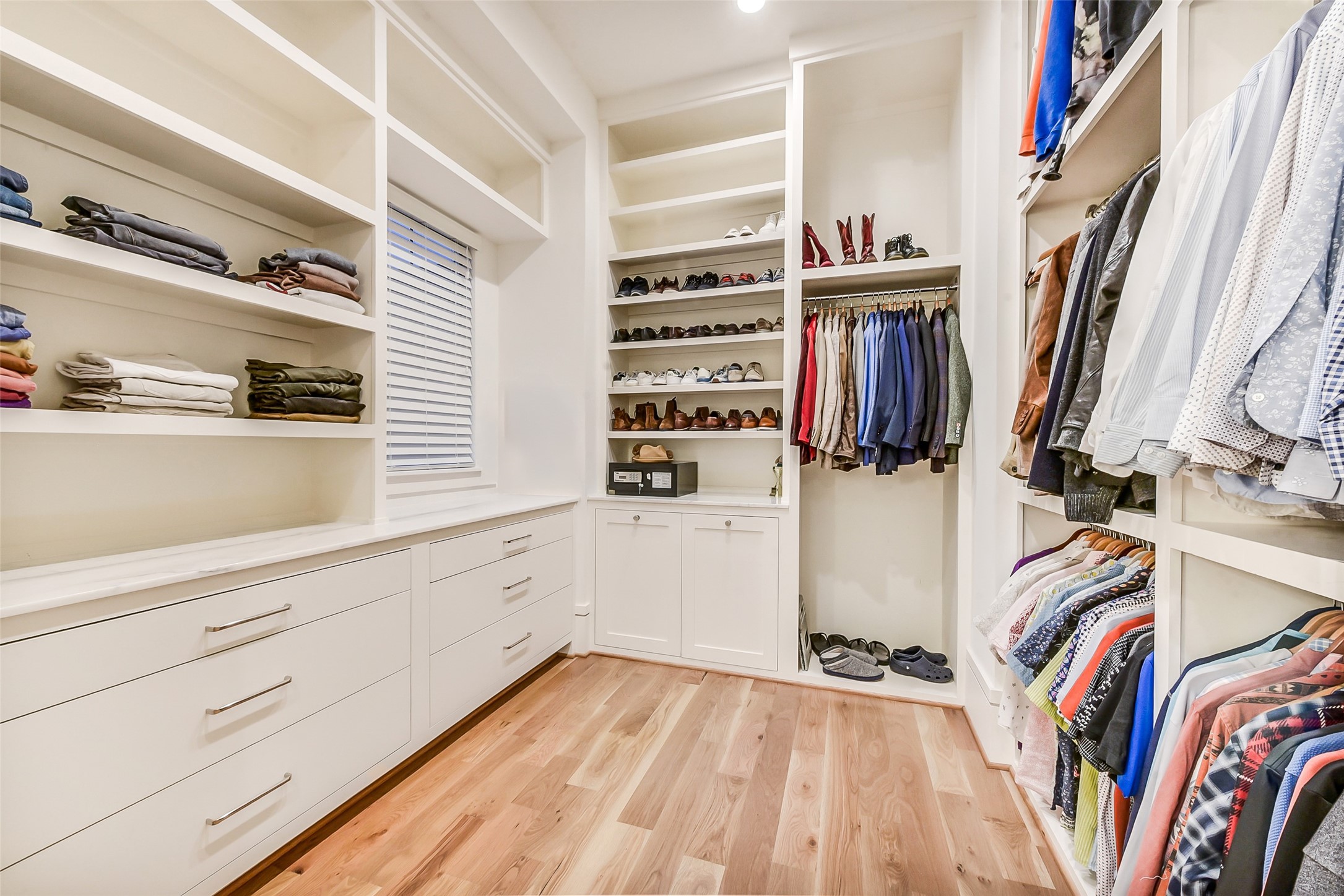 2205 Goldsmith Street Houston, TX 77030 - Photo 18 of 44 a view of walk in closet with clothes and shoes