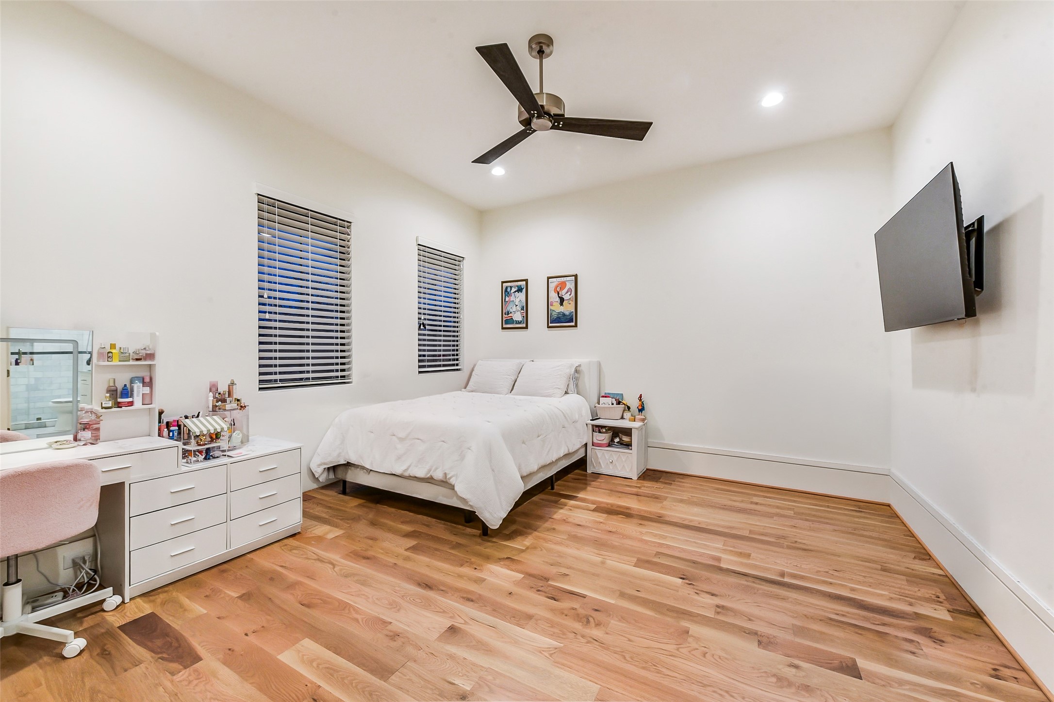 2205 Goldsmith Street Houston, TX 77030 - Photo 22 of 44 a bedroom with a bed a flat screen tv and a window