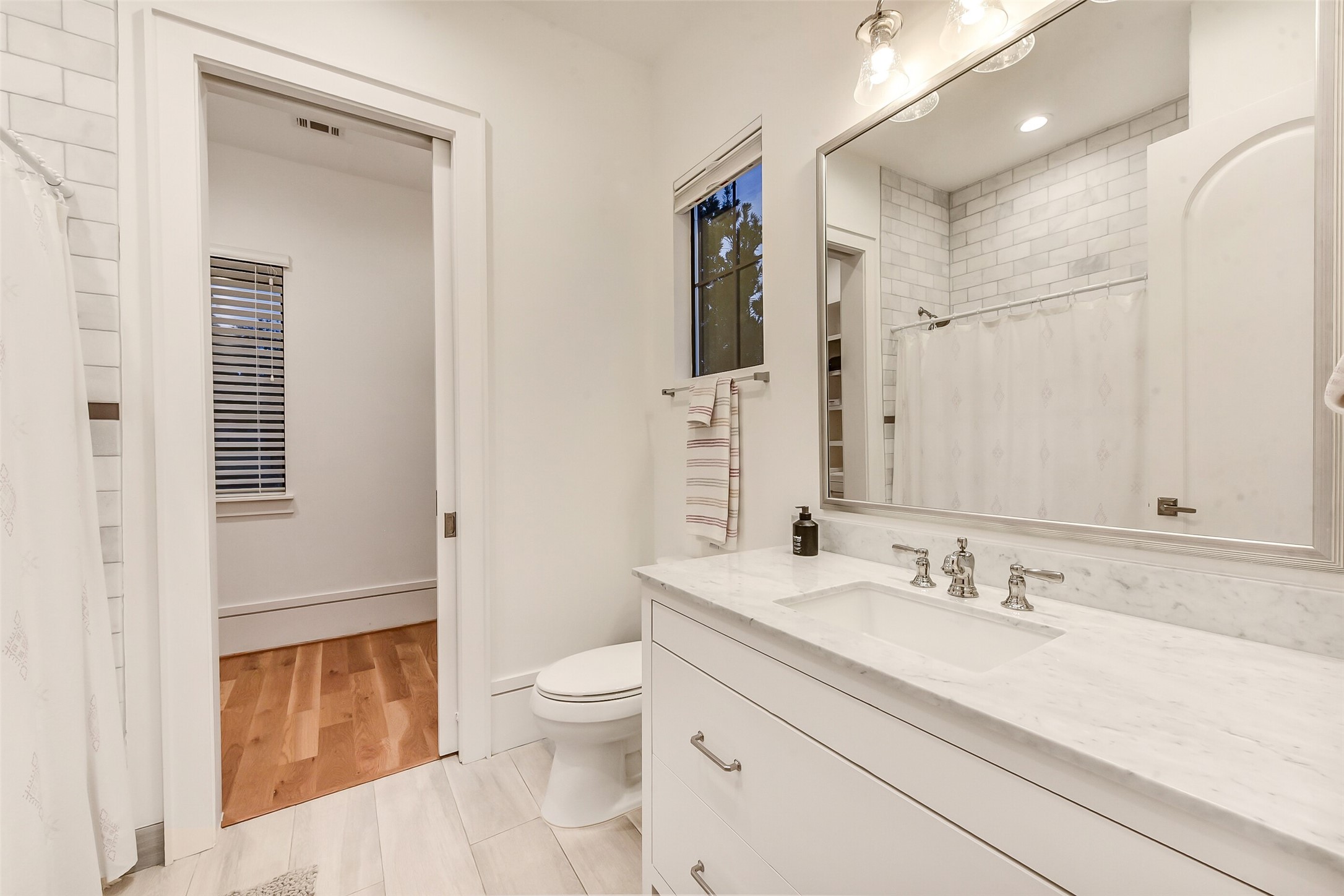 2205 Goldsmith Street Houston, TX 77030 - Photo 25 of 44 a bathroom with a sink a toilet and shower