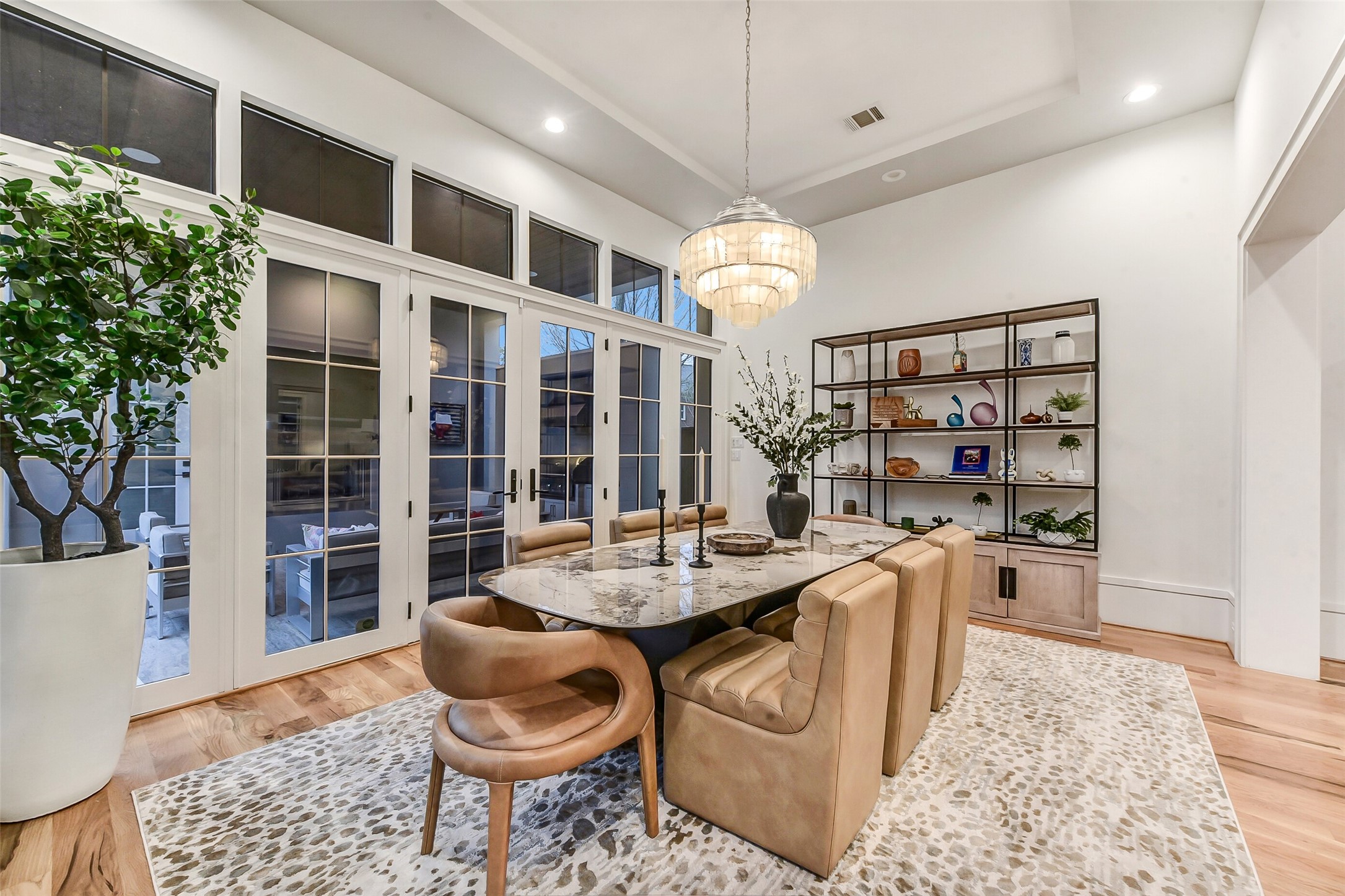 2205 Goldsmith Street Houston, TX 77030 - Photo 5 of 44 a dining room with wooden floor and chandelier