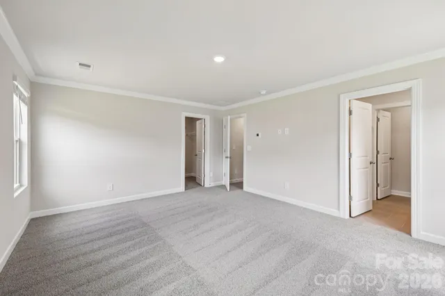 a bathroom with a shower and a glass door