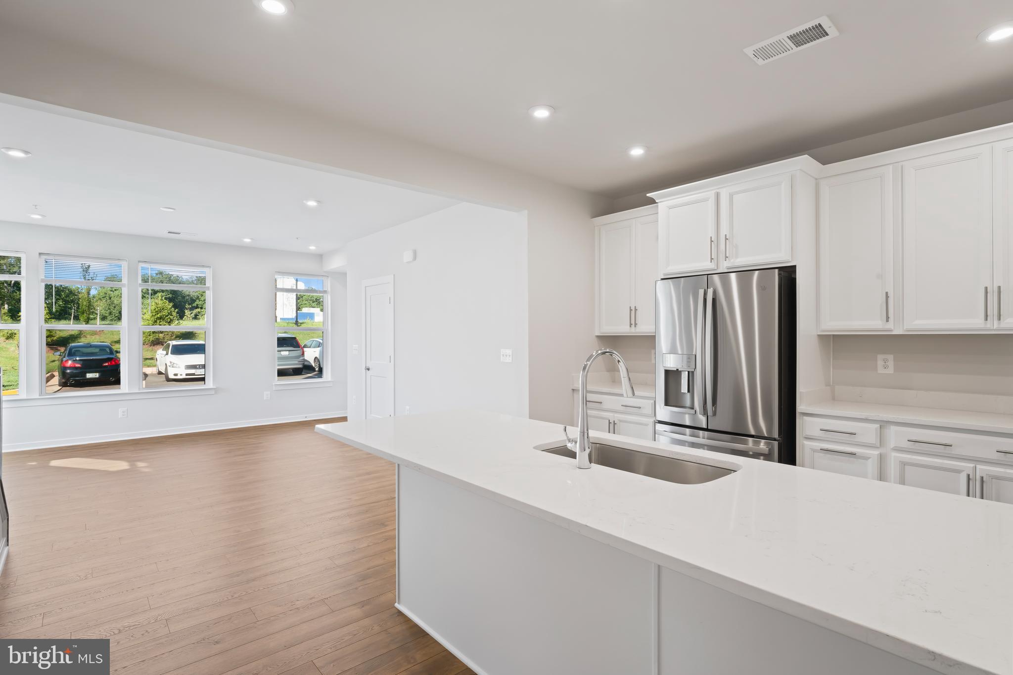 20364 Newfoundland Square Ashburn, VA 20147 - Photo 19 of 68 a kitchen with stainless steel appliances a sink and a refrigerator