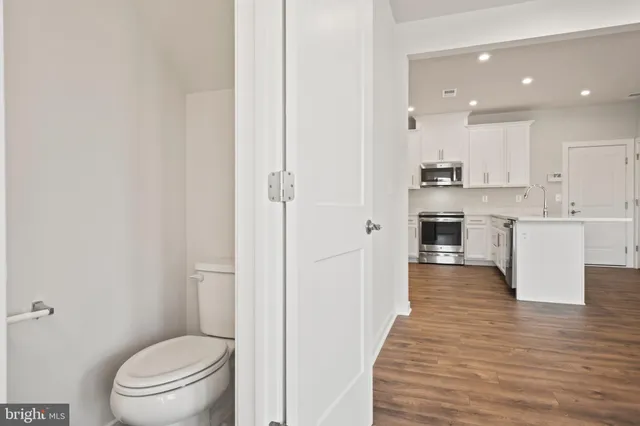a bedroom with a bed and glass window