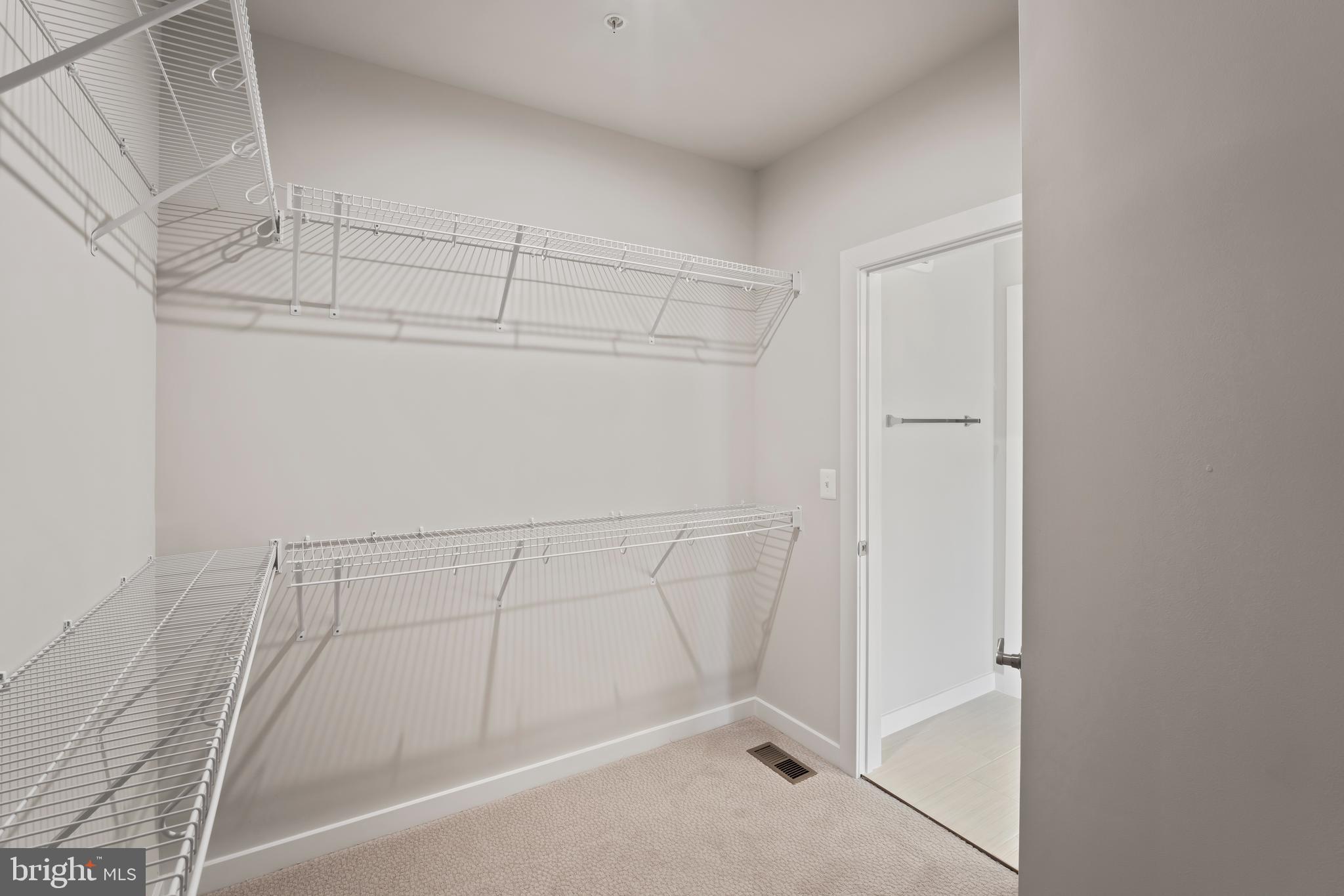 20364 Newfoundland Square Ashburn, VA 20147 - Photo 31 of 68 a view of a room with racks on the wall