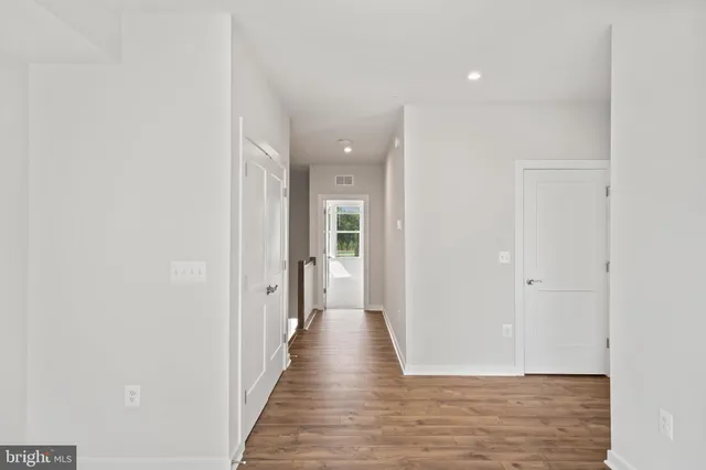 a living room with furniture and windows