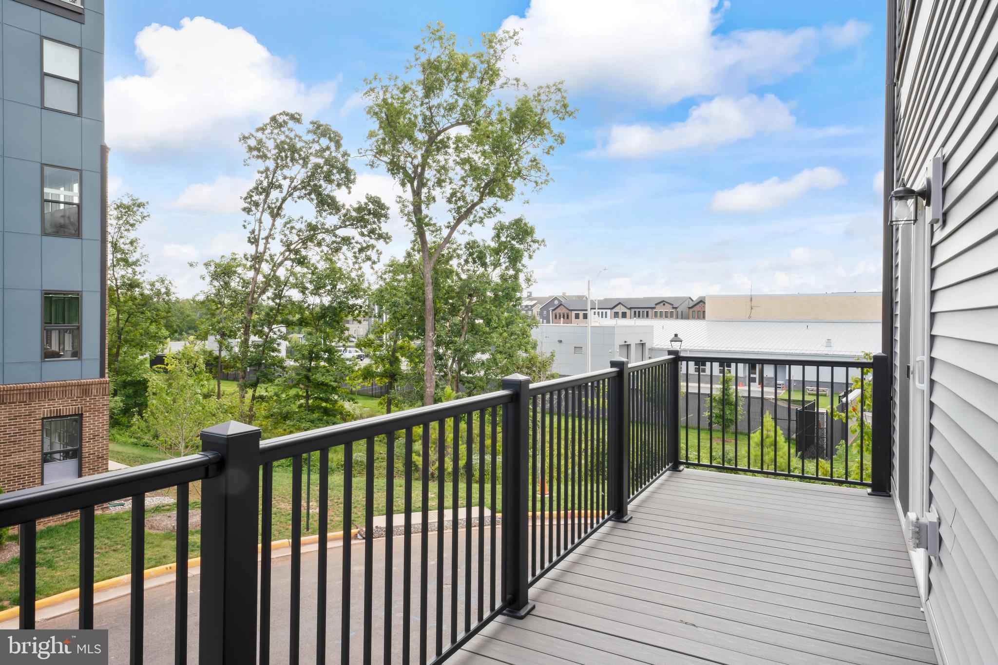 20364 Newfoundland Square Ashburn, VA 20147 - Photo 35 of 68 a view of a balcony with wooden floor & fence
