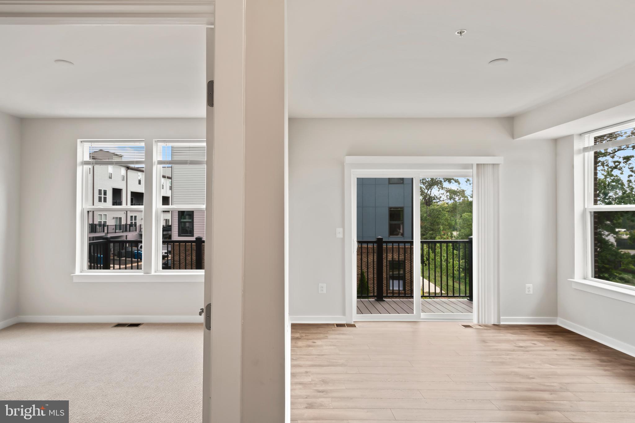 20364 Newfoundland Square Ashburn, VA 20147 - Photo 40 of 68 a view of an empty room with a window and wooden floor