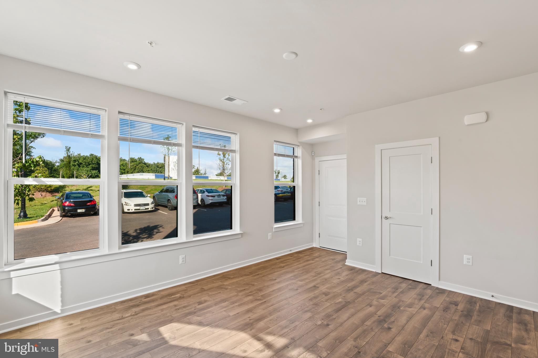 20364 Newfoundland Square Ashburn, VA 20147 - Photo 4 of 68 a view of an empty room with window and wooden floor