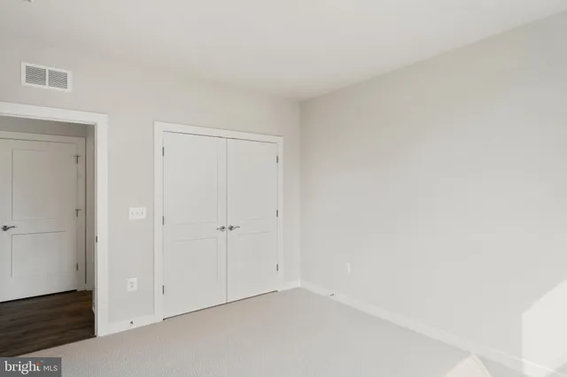 a view of a patio with swimming pool and sitting area