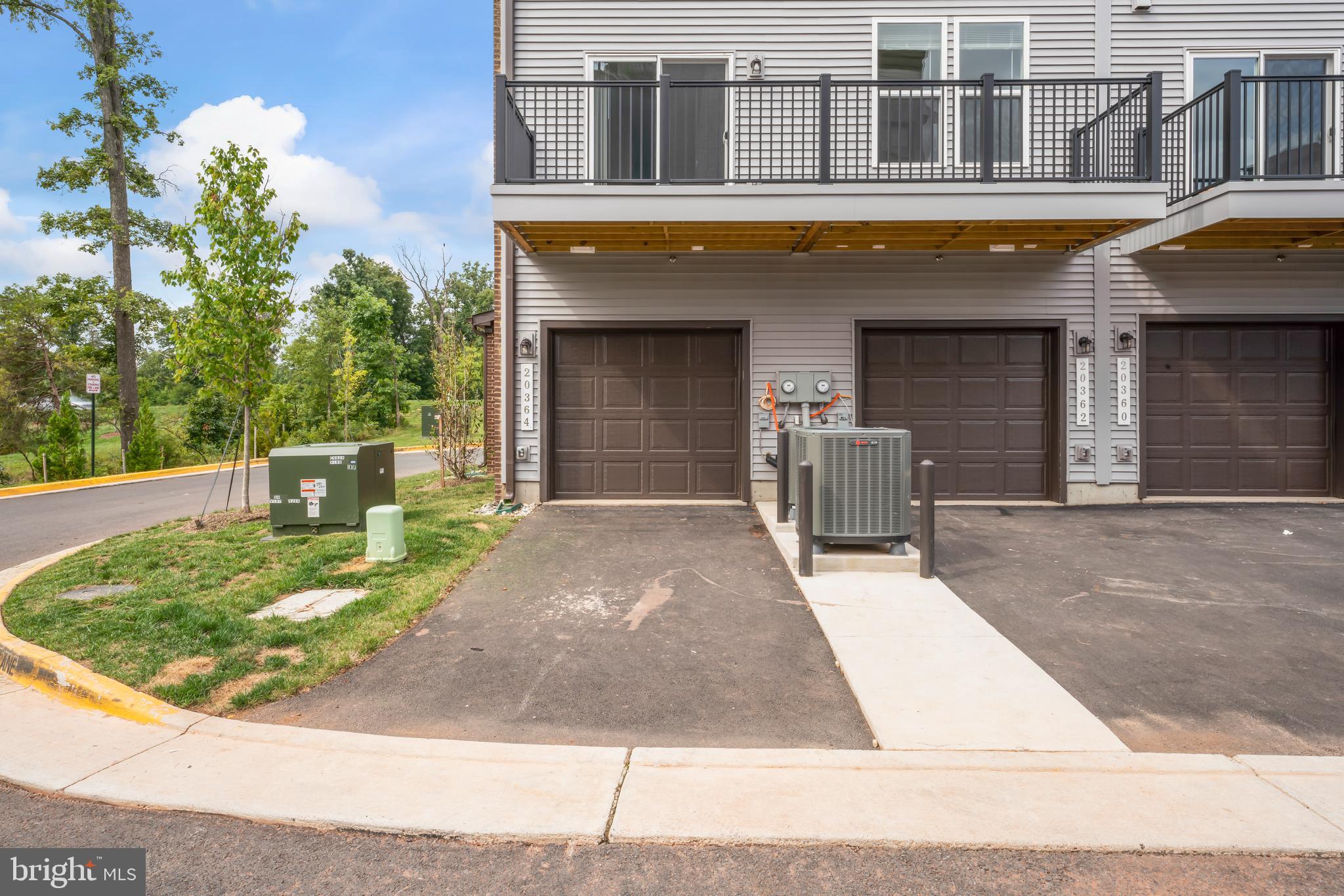 20364 Newfoundland Square Ashburn, VA 20147 - Photo 50 of 68 a front view of a house with entertaining space